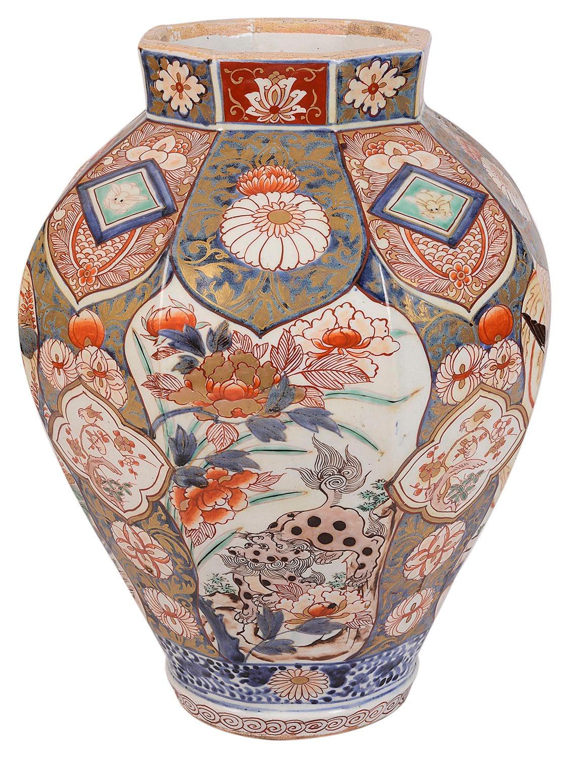 An 18th Century Arita Imari porcelain vase / lamp. Having wonderful bold colouring to the scrolling motif decoration, with inset hand painted panels depicting exotic flowers a mythical Foo Dog, circa 1780.
 
Batch 72 