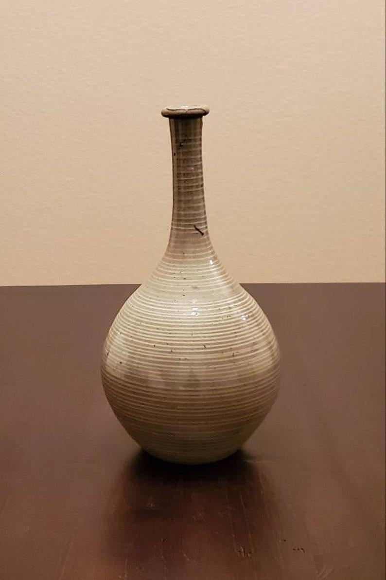 A rare and beautiful nearly 300 year old Edo period (1603-1868) Japanese Seto ware glazed ceramic bottleneck wine bottle / vase. circa 1750

Hand-crafted by a highly skilled artisan in the 18th century at one of the 