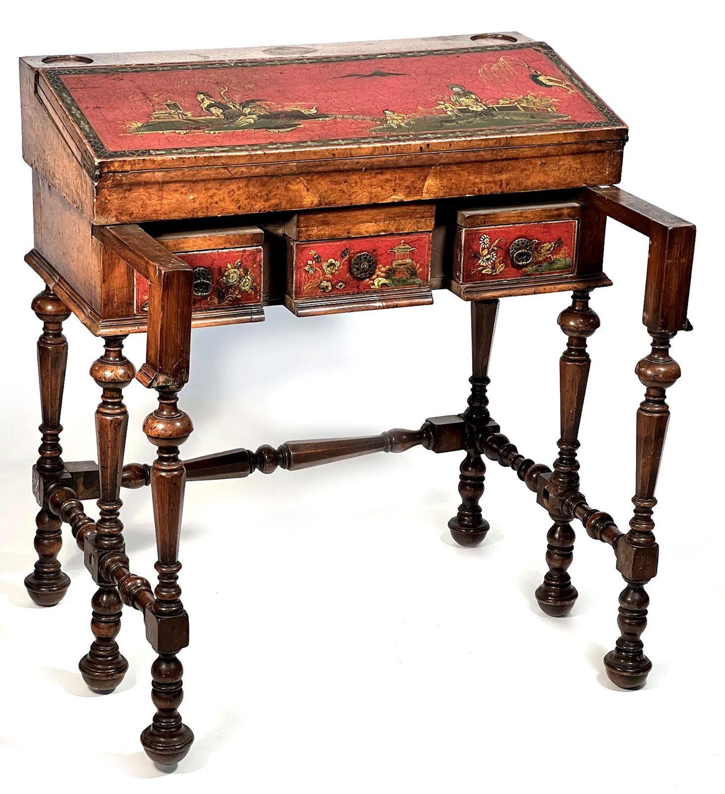 A 19th century Japanese style English writing desk made from walnut. The slant front opening to a writing and storage area with three drawers.
Dimensions: 35 1/2