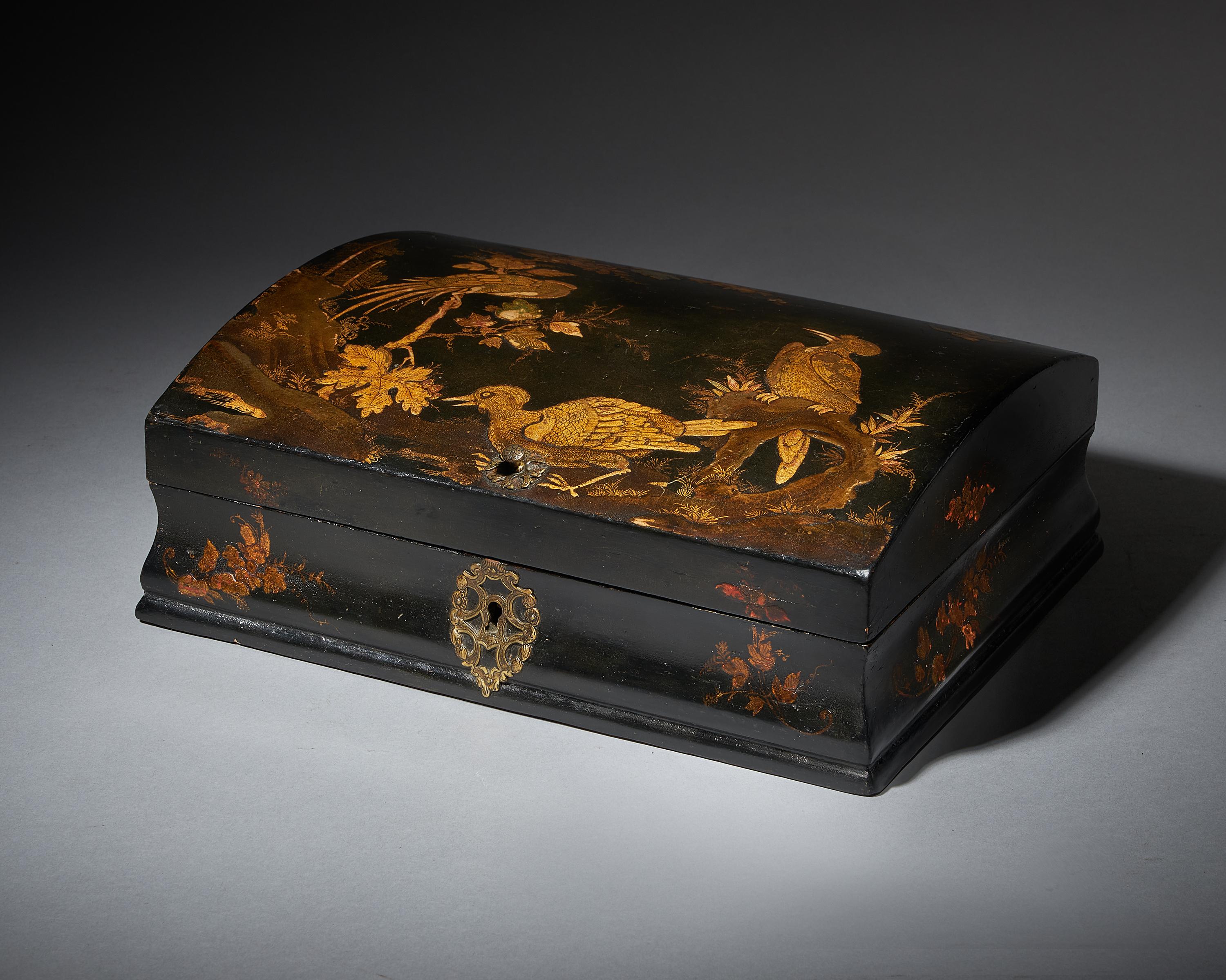 Early 18th century George I Japanned Chinoiserie dome-topped box, Circa 1715-1725. England or France.

A rare survivor from the first quarter of the 18th-century depicting scenes of various birds, a rock formation and foliage, all finely drawn on a