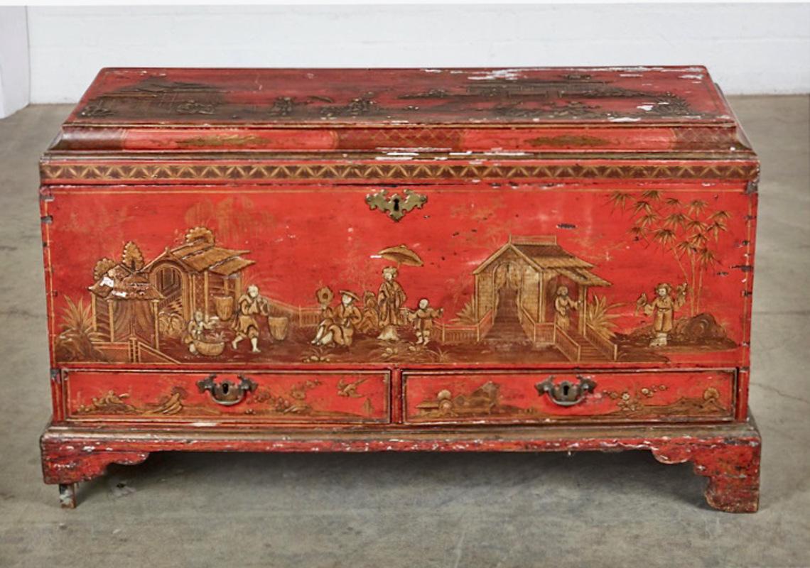 This a George II/George III Chest or Trunk that retains its original red Japanned surface. The chest features a molded lid typically found in George II/ early George III coffers. The is composed of two drawers over bracket feet with the trunk