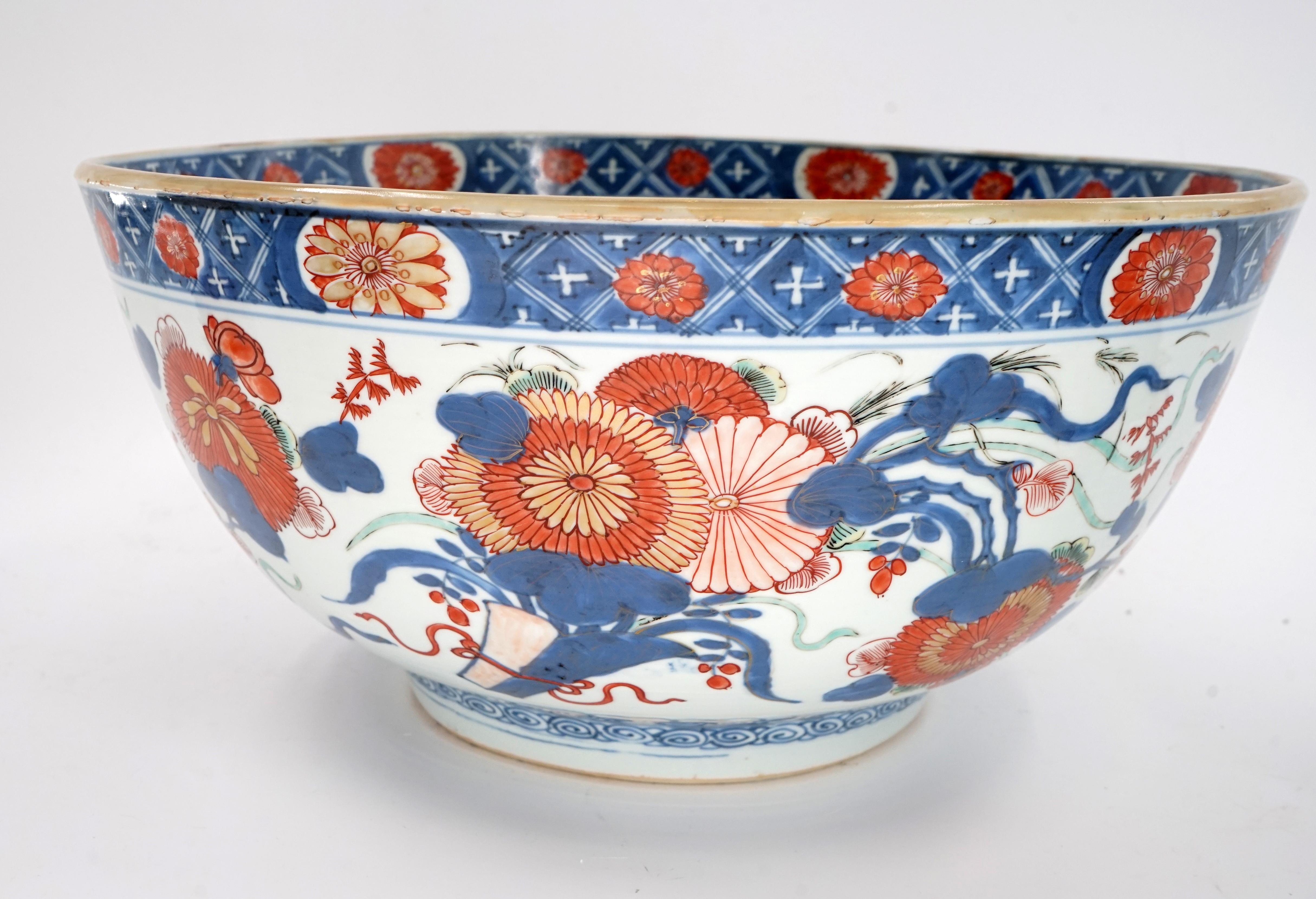 Very Rare Large Chinese Imari Punch Bowl 14 Inches in Diameter

6 1/2 inches in height

Circa 1740 Chinese Kangxi Classic Florida Design

Provenance: Dealer Label Guest and Gray of London (highly respected specialist in Chinese ceramics)

