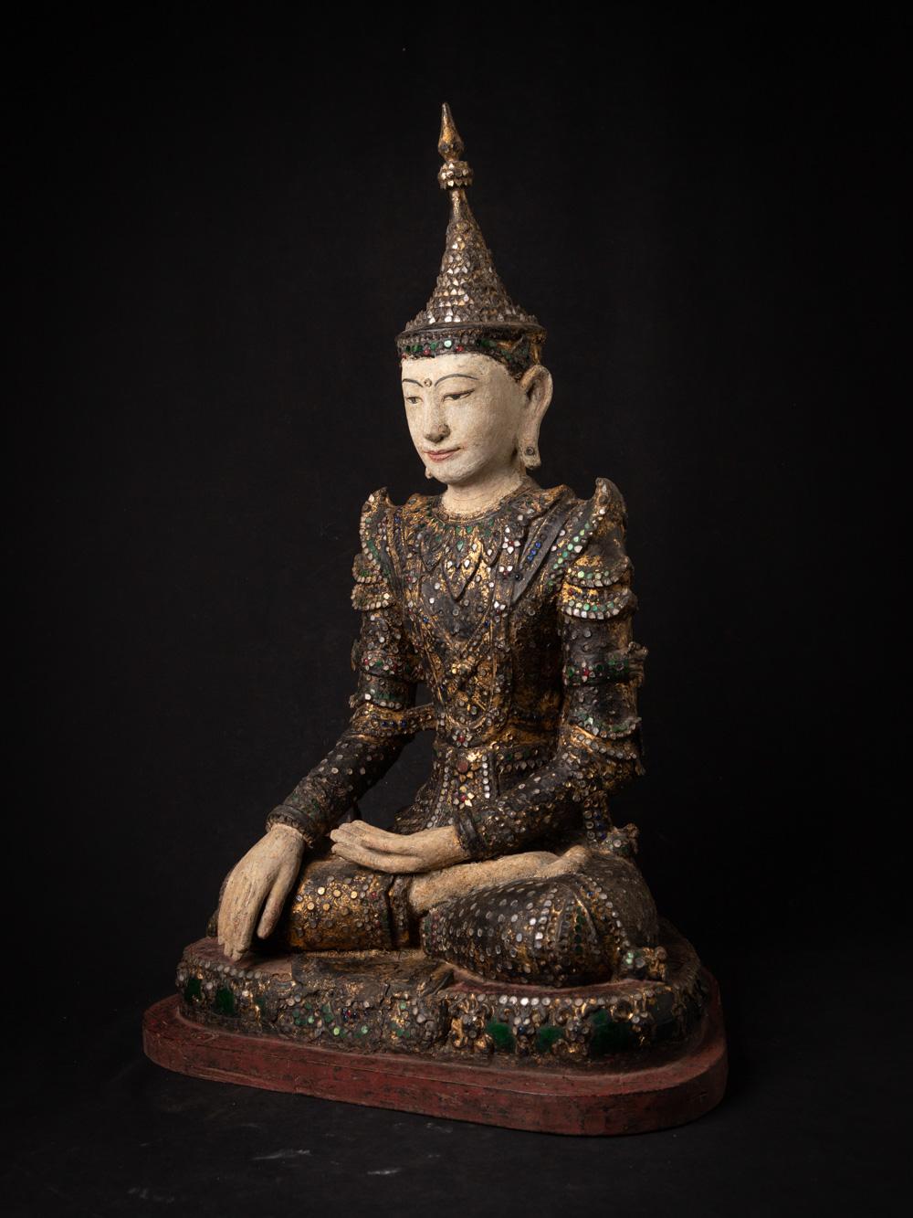 The antique wooden Burmese Buddha statue is a magnificent and historically significant artifact originating from Burma. Crafted from wood, this statue stands at an impressive 74 cm in height and measures 49.5 cm in width and 37.5 cm in depth. The