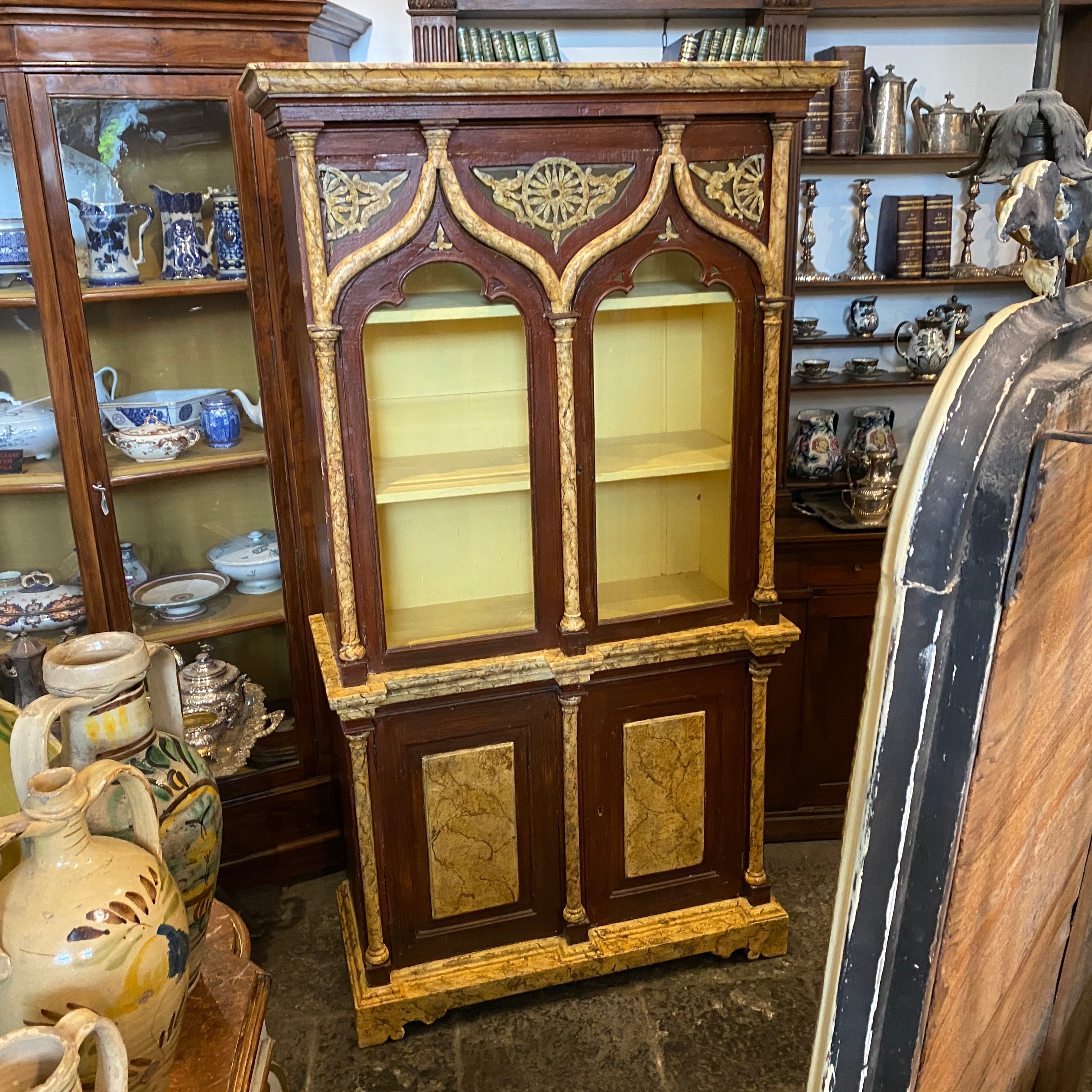 An antique neo gothic credenzas hand-crafted in Sicily at the end of 18th century, the lacquered fake yellow siena marble it's in very good conditions. Original glasses, it has been never restored only cleaned.