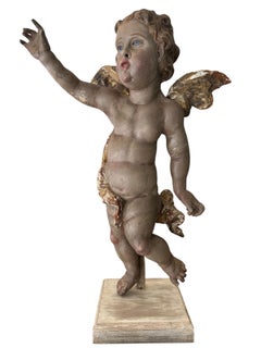 Putto in legno intagliato, policromo e parzialmente dorato, in stile barocco bavarese del XVIII secolo