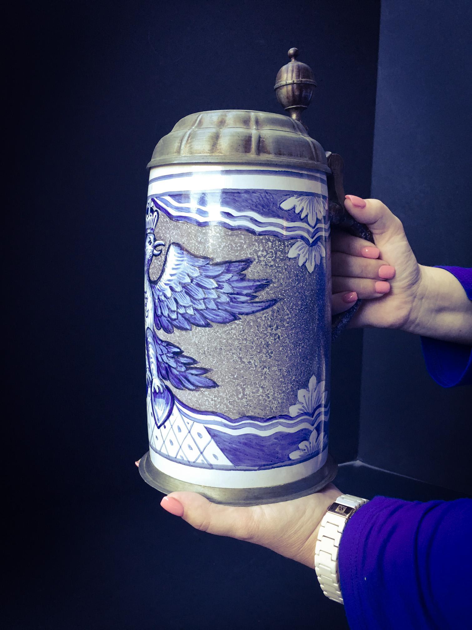 This exceptional large faience tankard is painted polychrome with the royal eagle and crest of Frederick the Great of Prussia. The initial FR stands for Fridericus Rex. The background of this tankard is decorated in a rare sponged manganese color.