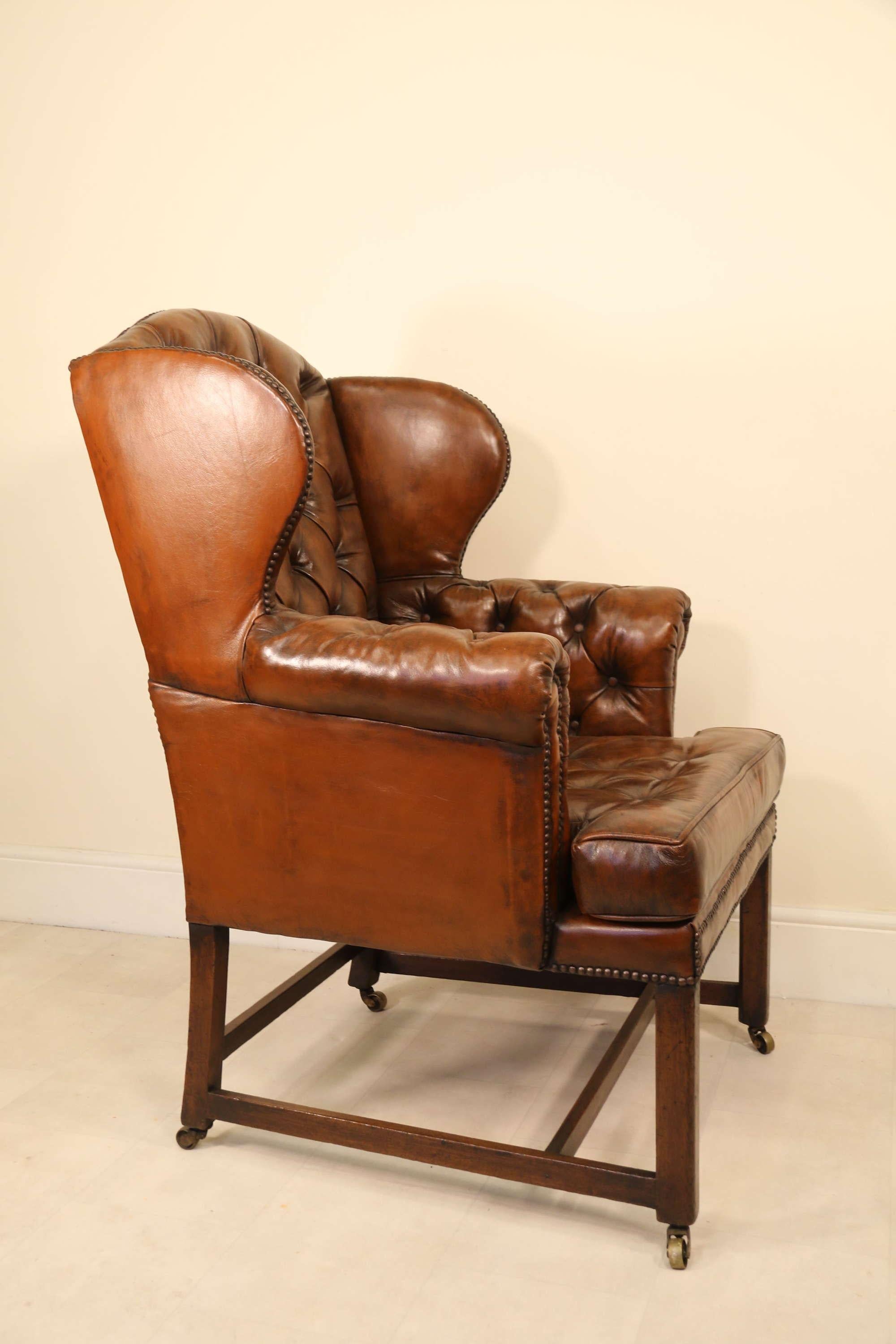 18th Century Large Leather Upholstered Wingback Armchair, Georgian

This handsome and larger scale George iii wing backed armchair has recently been finely reupholstered in deep buttoned dark tan leather which has been hand finished to give a well