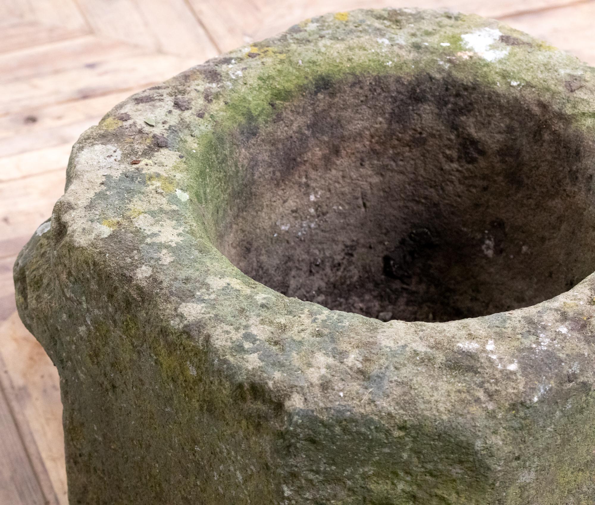 A stunning large 18th century carved York sandstone mortar. The large mortar is typically simple in its decoration and is formed from a cube of stone with chamfered canted corners and circular basin. The mortar has a wonderful weathered patina.