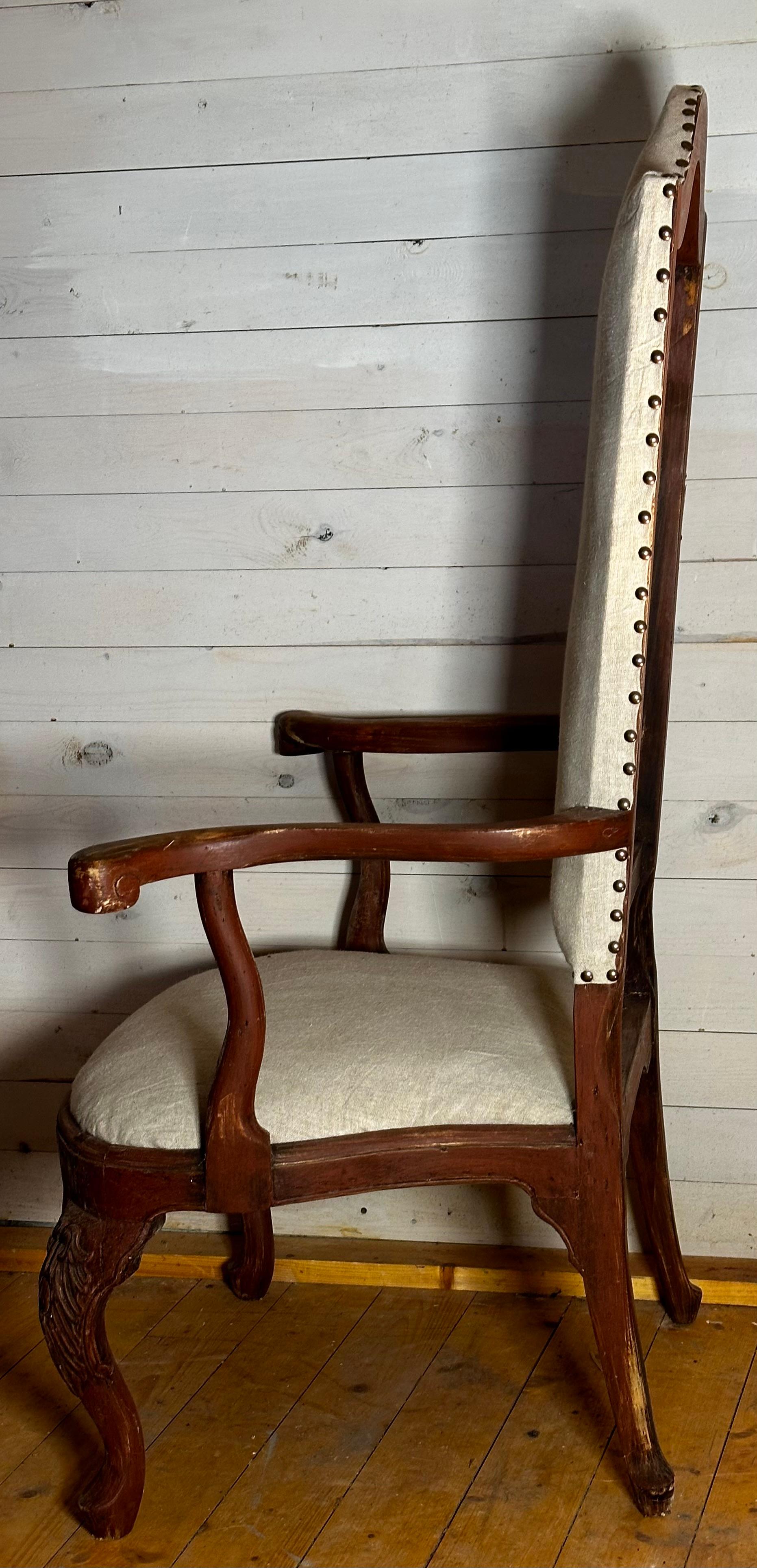 Armchair made in Sweden about 1740. The armchair has an unusual high back, that could suggest that it were made for a Government. The original color is well preserved with much of indigenous textures remains.