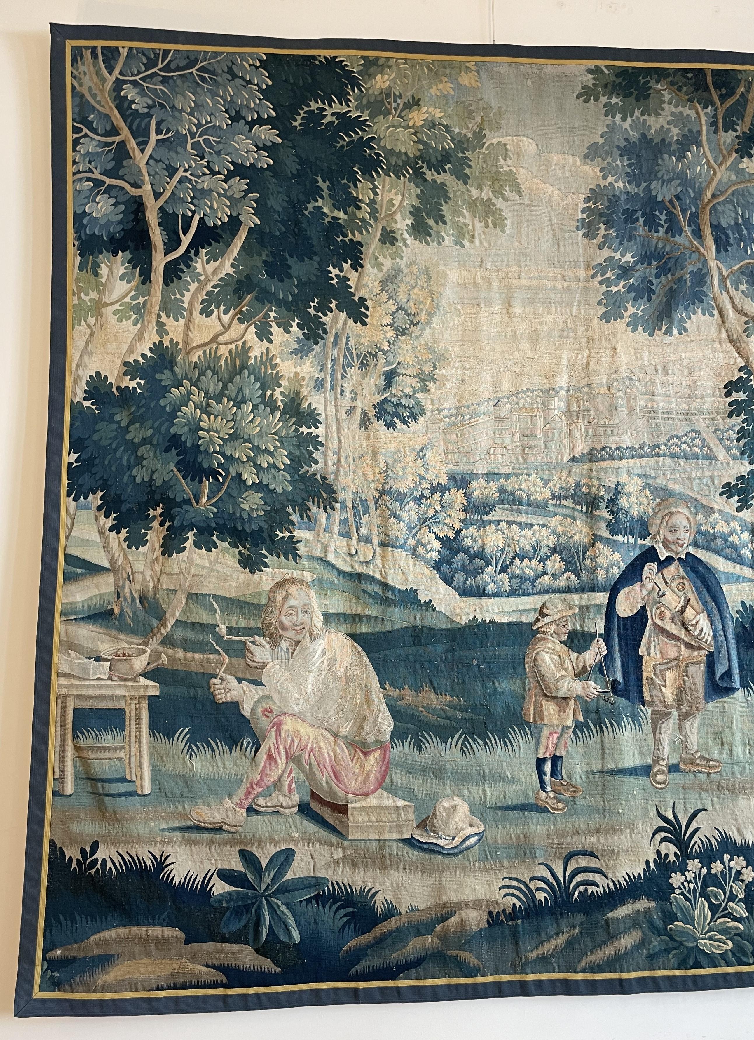 superbe et rare tapisserie en laine et soie du début du 18ème siècle d'après un tableau de Teniers

Très belle tapisserie représentant une scène de village avec des danseurs, des fumeurs de pipe et des musiciens et, en arrière-plan, des châteaux et