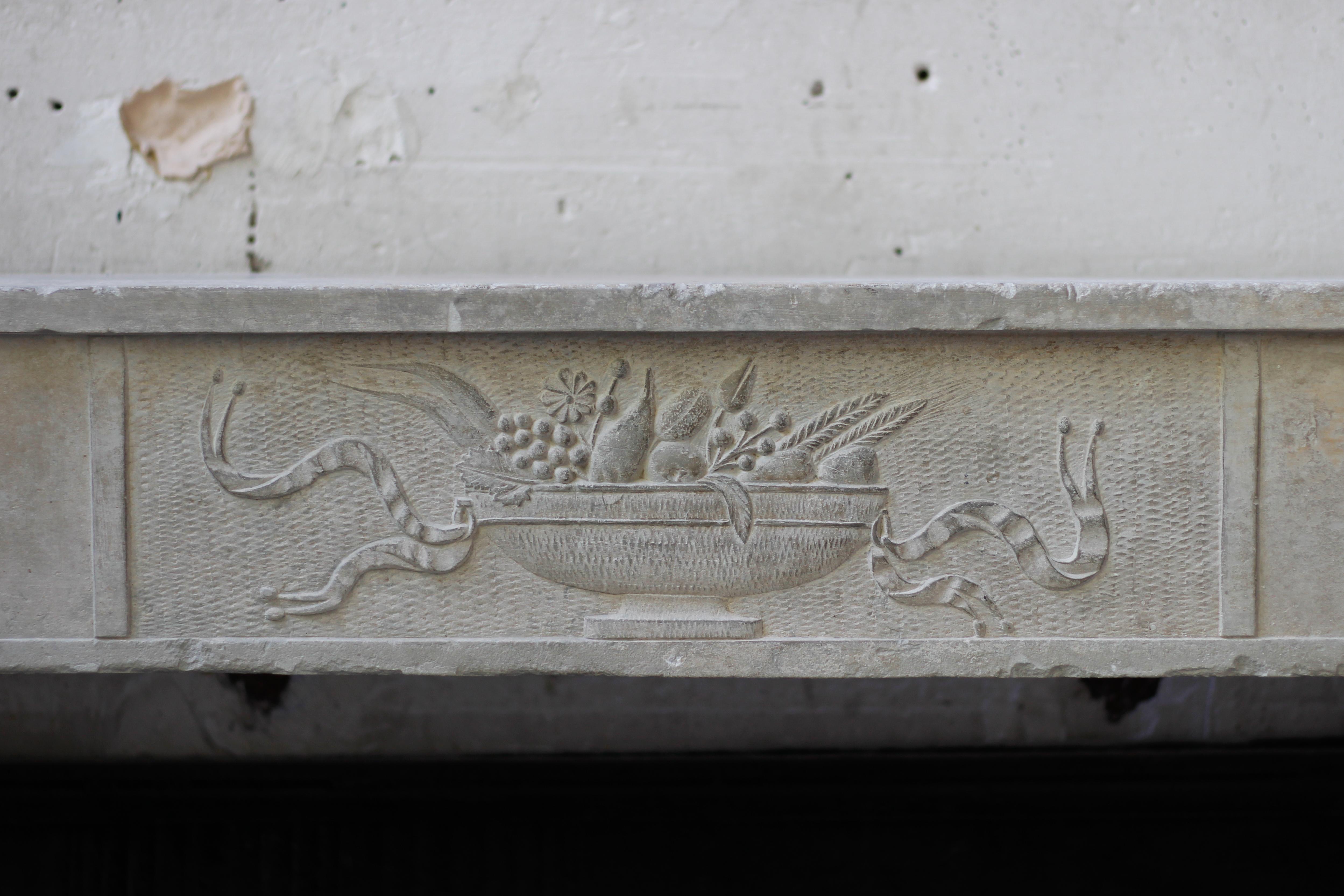 Rare and nice 18th century limestone countryside style fireplace mantel.
The entablature is carved with a fruit basket low relief in its center and flowers at each end
The jambs are also decorated with fluting and acanthus.

 