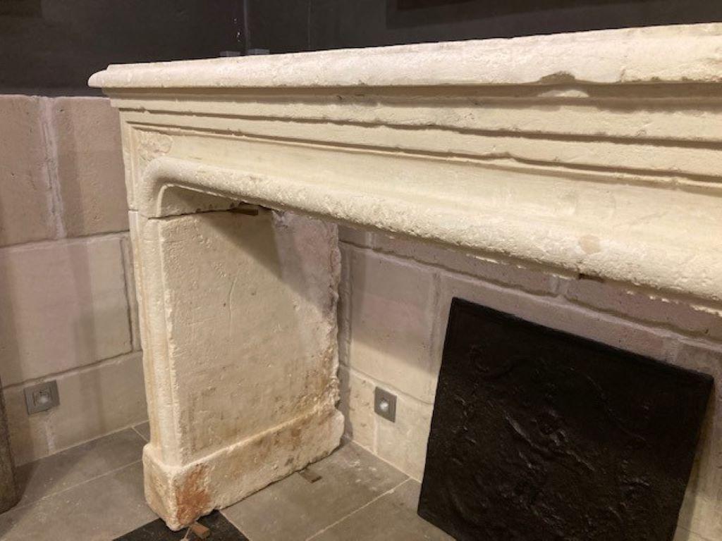 Carved 18th Century Limestone Fireplace