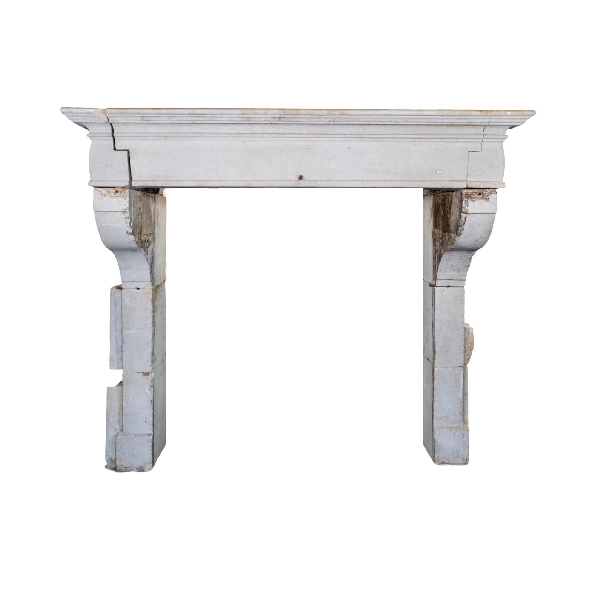 This antique and reclaimed mantel is crafted from French limestone, originating from Bordeaux in 1780. Its authentic material and vintage origin add a touch of elegance to any fireplace.