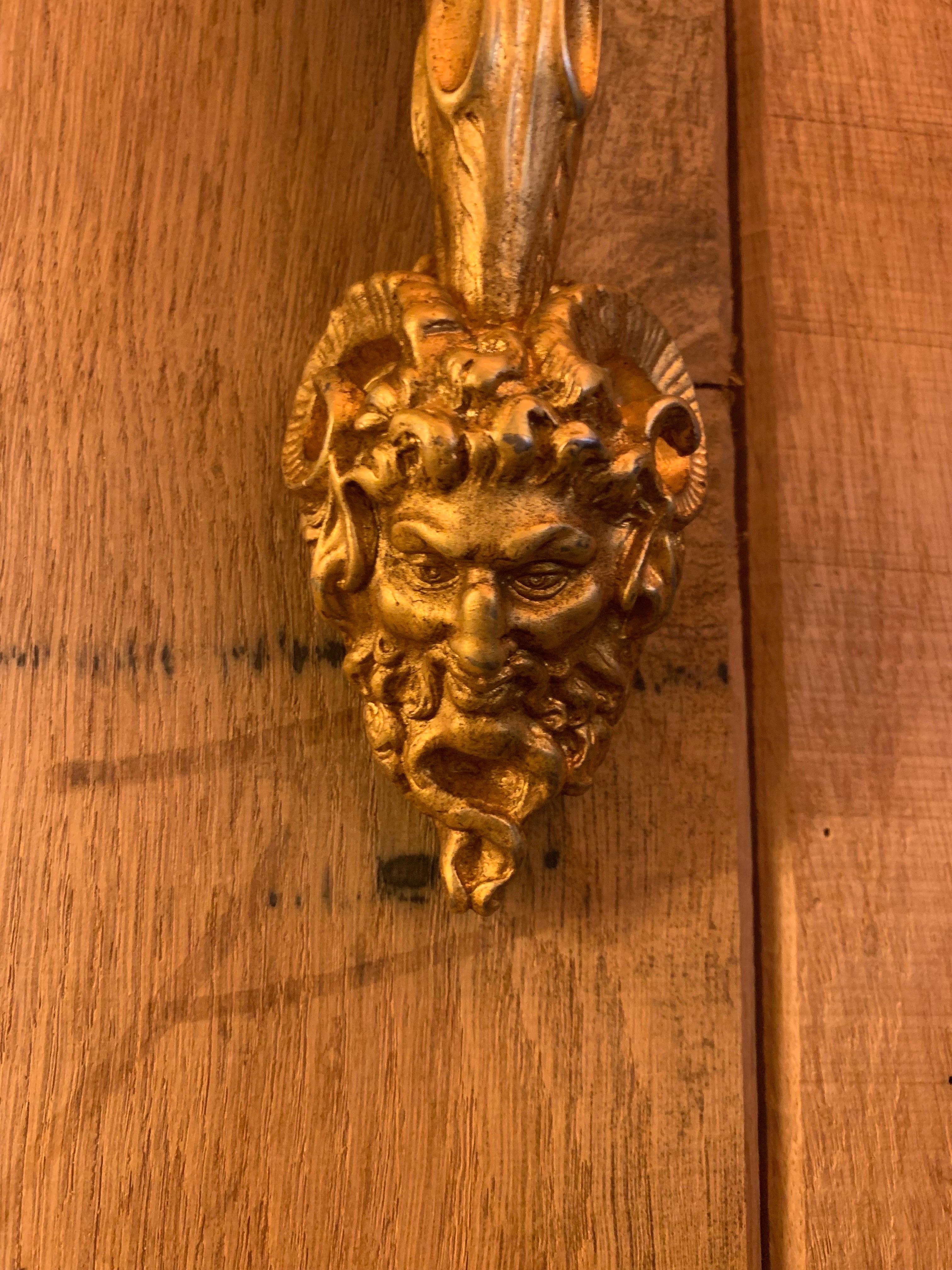 Splendid pair of torch in gilded bronze patinated 24K. The wall support is a lion head biting a rope wrapped around the torch.

We have one pair in stock however we can produce them made to measure and in other finishes such as 18k gold, 24k gold,