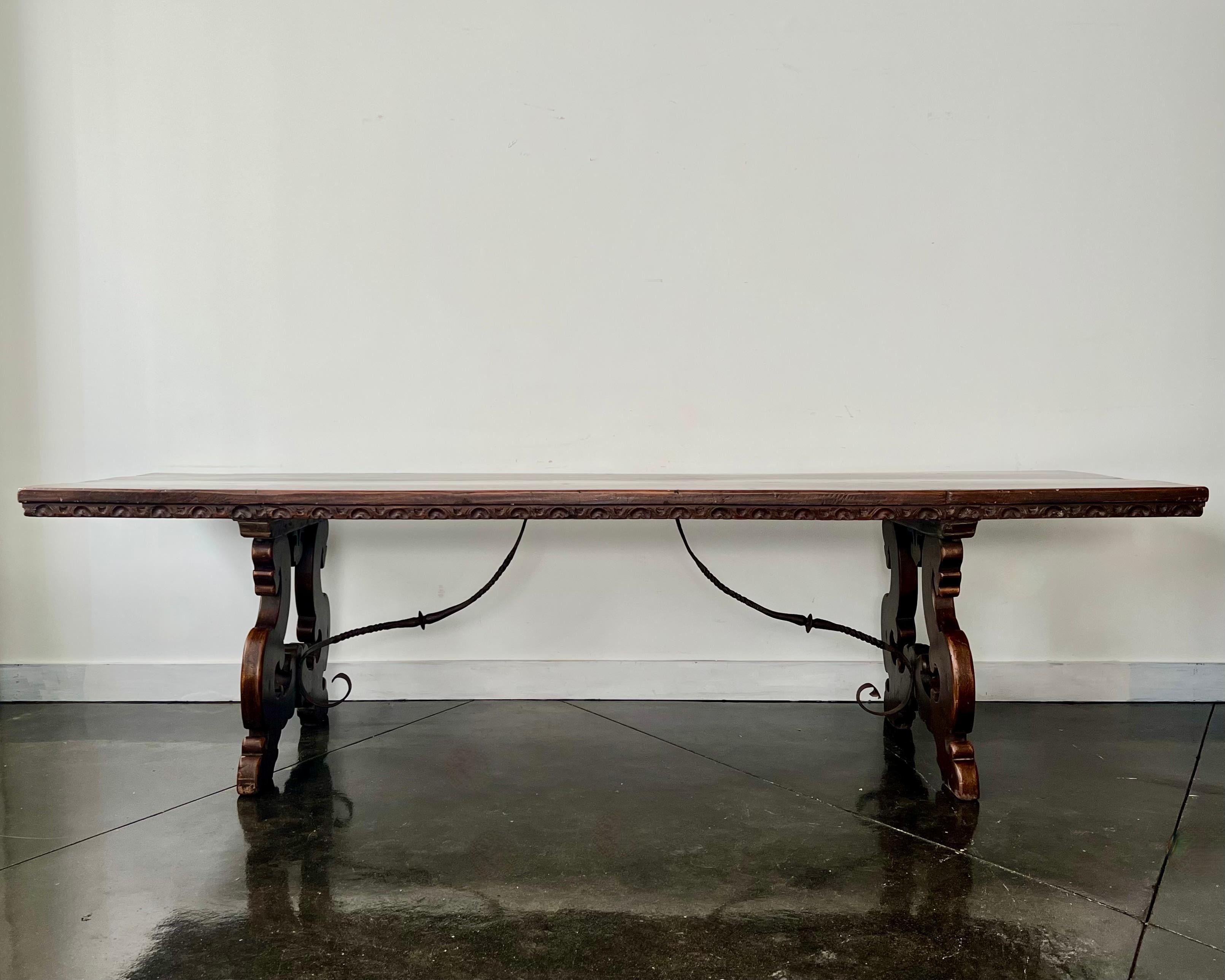 Hand-Carved 18th Century Long Walnut Florentine Italian Dining Table with Iron Strecher For Sale