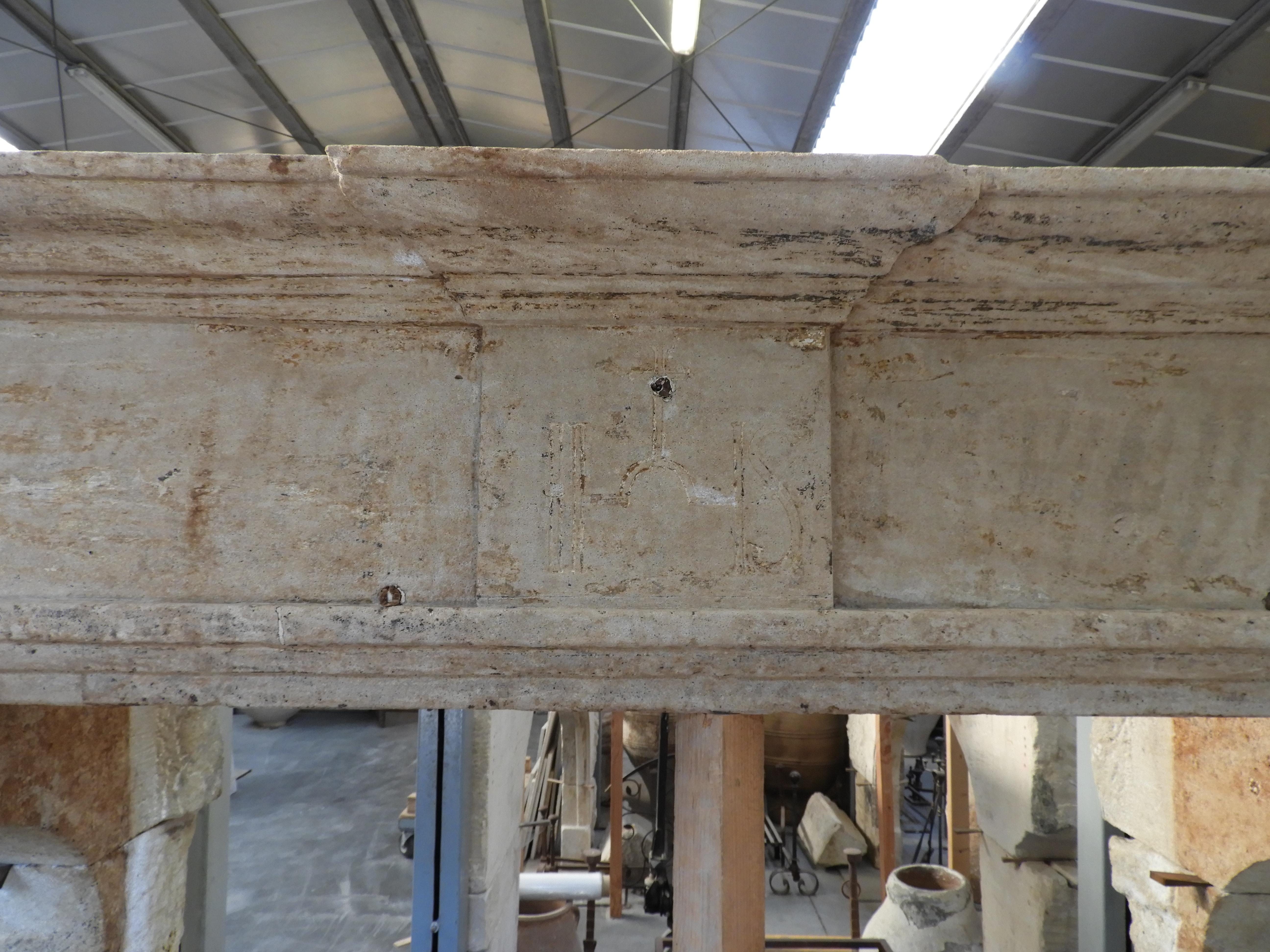 18th century fireplace in French limestone from a presbytery. Nice patina in in very good condition, the interior sizes are 161 cm wide x 147 cm high.