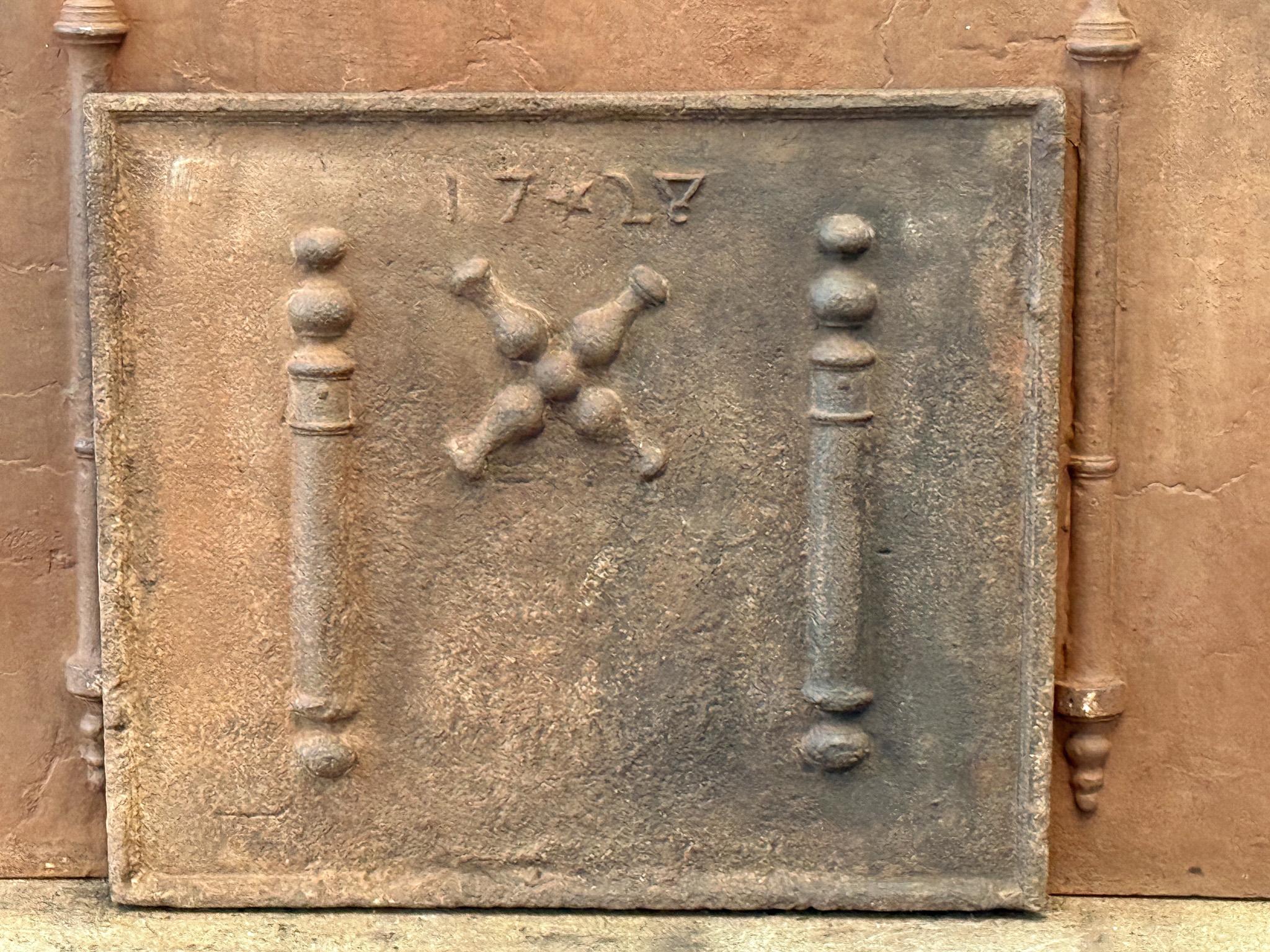 18th century Louis XIV Period French fireback with a Saint Andrew's cross and two pillars of Hercules. Saint Andrew is said to have been martyred on a cross in this shape. As a result, the cross became a sign for humility and sacrifice. The pillars