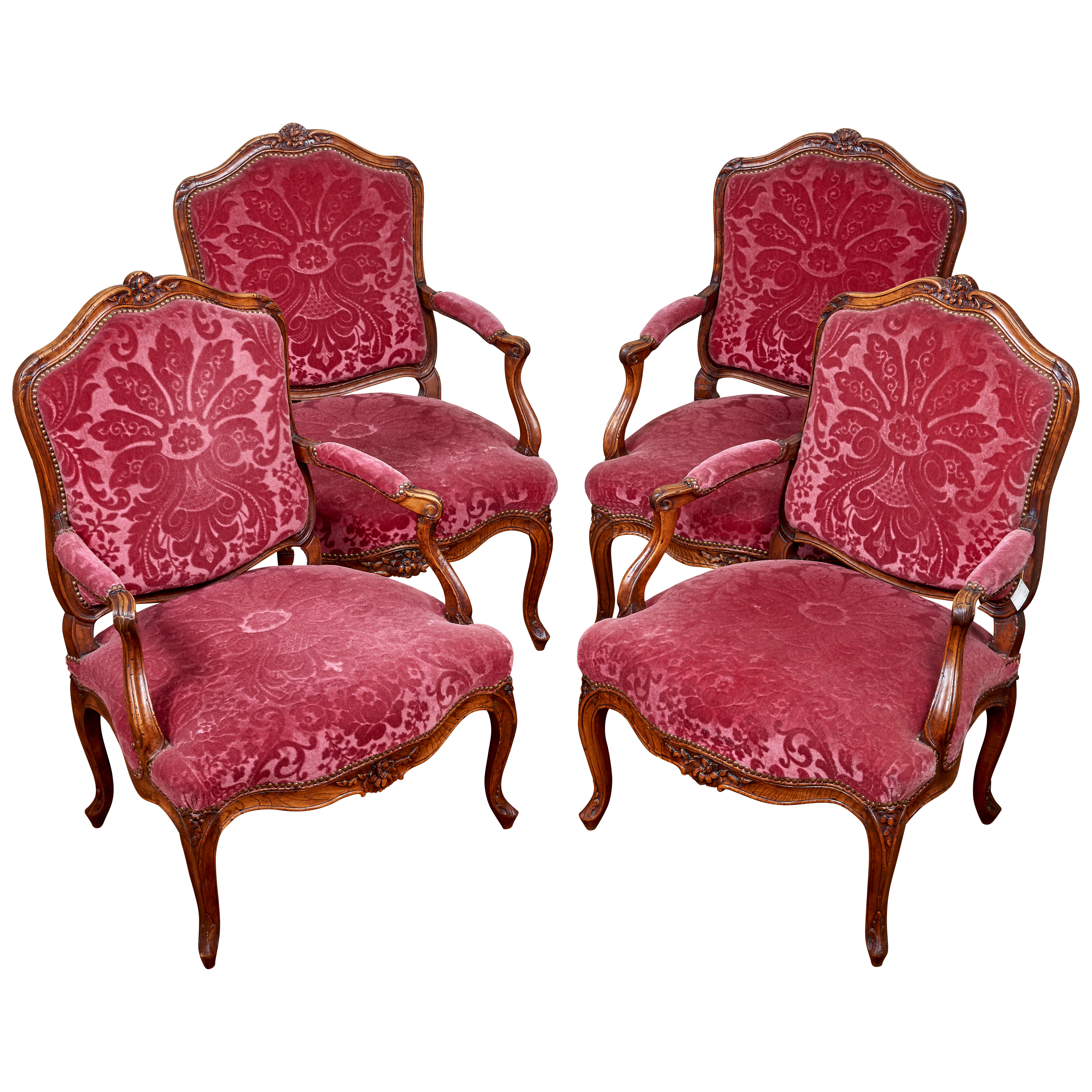 Four armchairs in natural wood and old pink damask cotton velvet. Typical work in taste of Nogaret.
Made in France probably in Lyon, circa 1750-1760.
   