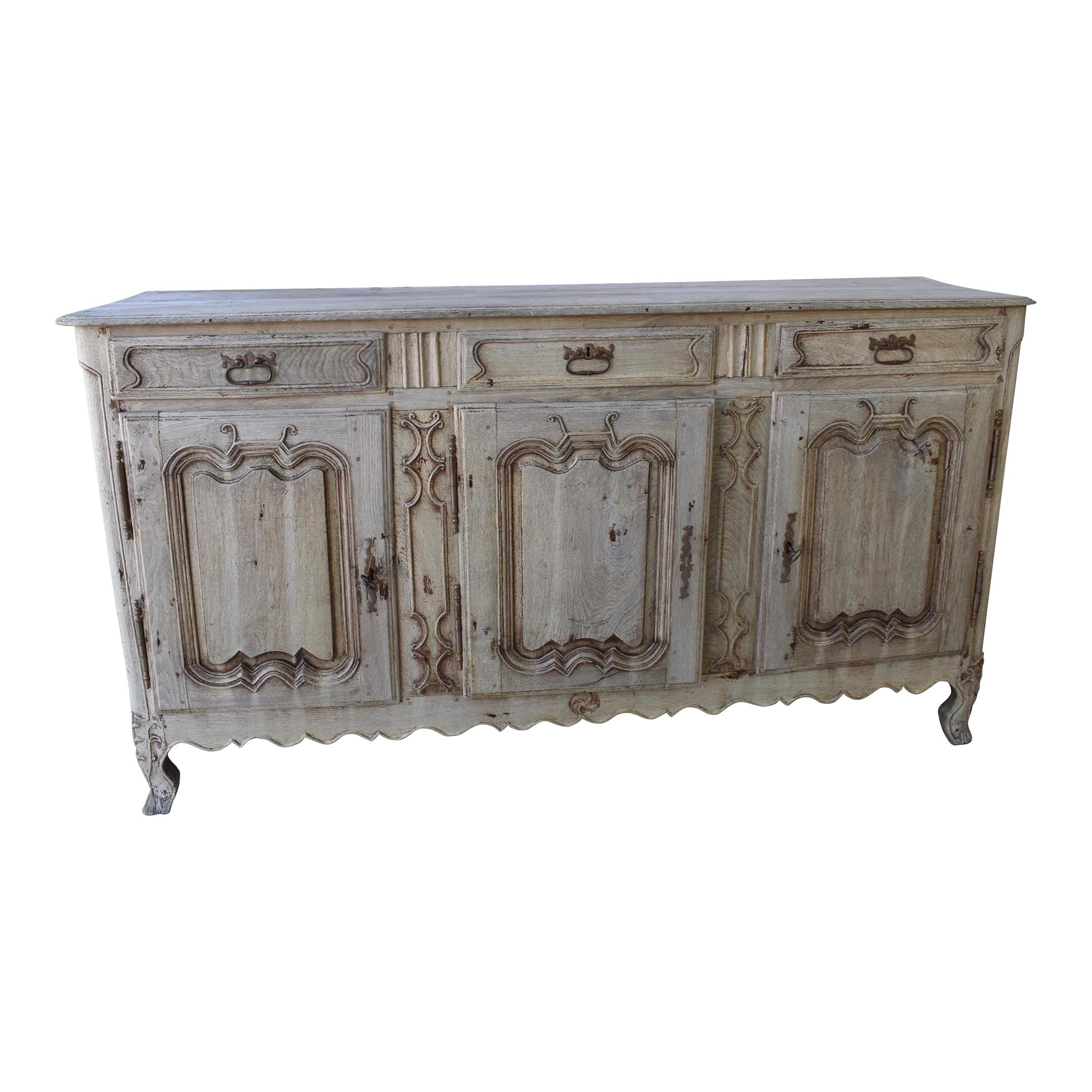 This is a beautiful, well-built and large period buffet that has style, and elegance. This gorgeous piece was built in the mid 1700s using all pegged construction and solid oak. The buffet features 3 drawers over three doors, all decorated with