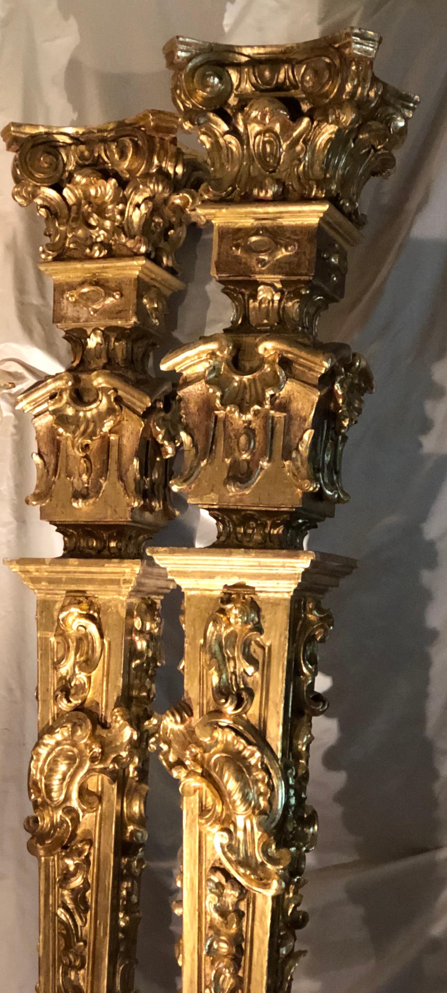 These are a (true) pair of tall Louis XV Columns/ Pedestals created by a Master Sculpteur in the mid 18th century Rococo period. They are sumptuous hand-sculpted by a master craftsman . They are creations which, in the eye of a Paleophile of the