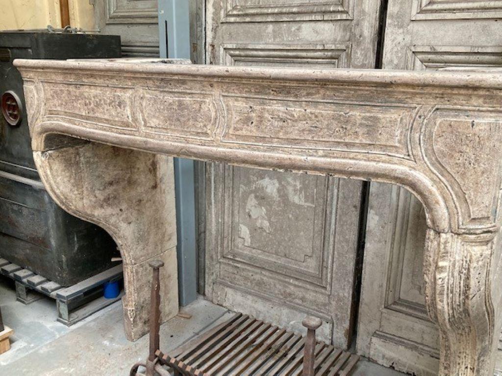 Carved 18th Century Louis XV Fireplace Mantel in French Limestone For Sale