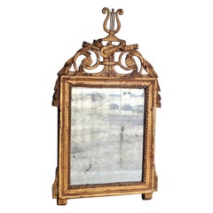Specchio in legno dorato Luigi XV del XVIII secolo