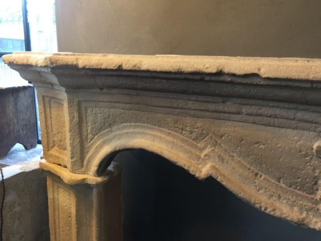 Carved 18th Century Louis XV Limestone Fireplace Mantel For Sale