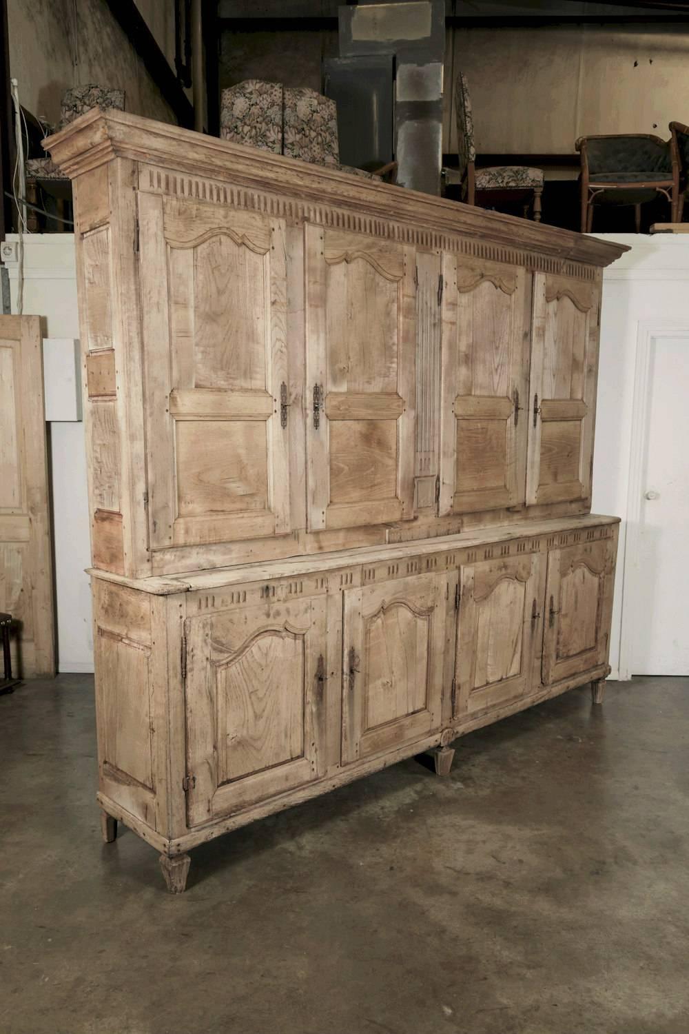 A monumental 18th century bleached walnut chateau buffet deux corps, handcrafted by talented artisans from Aix en Provence during the French Transition period (1750-1775). Most Transition period pieces were created outside Paris by provincial