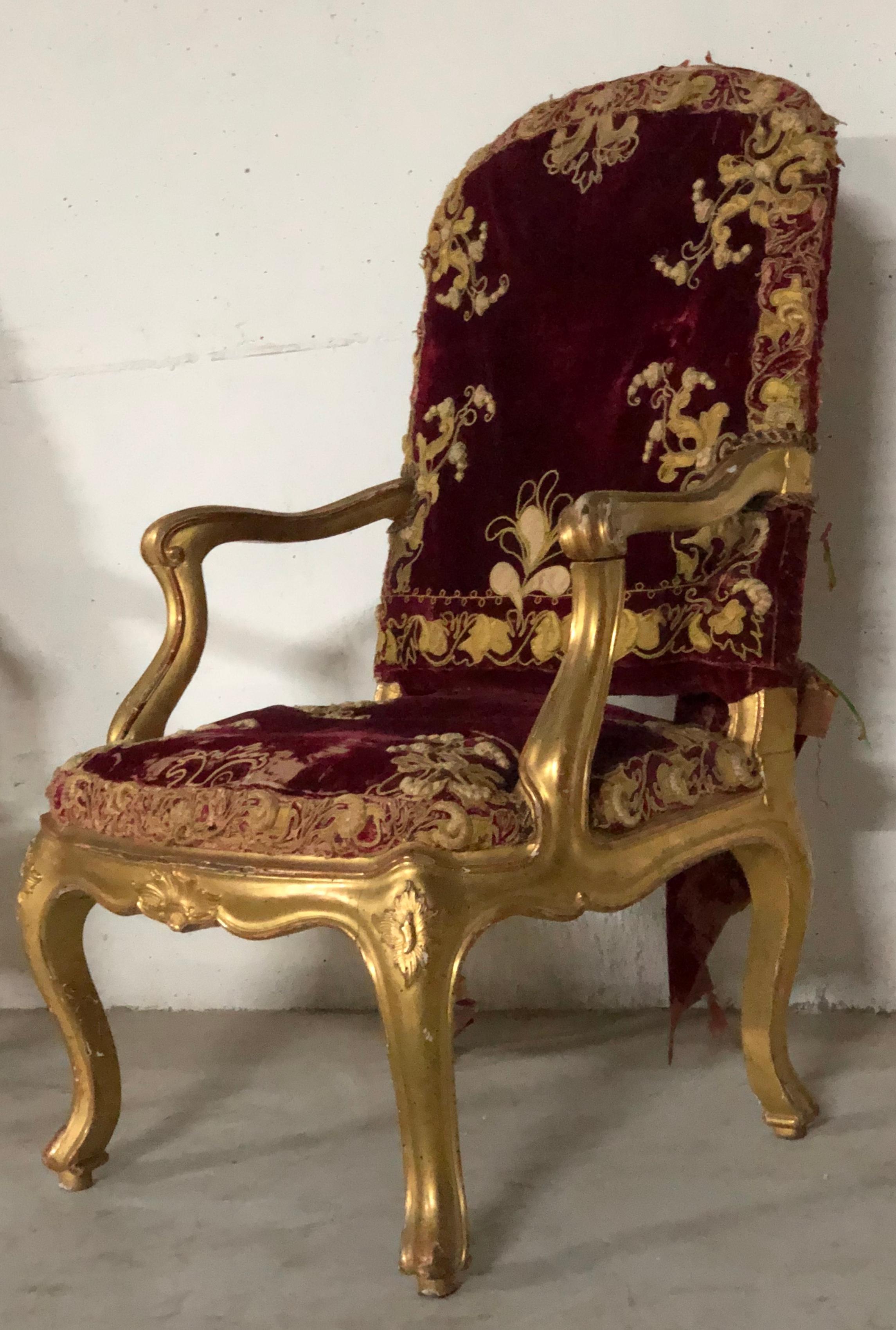 A very impressive pair of original and beautiful pair of Louis XV wooden gilt armchair. The fabric is original of the period with some small signs of age.