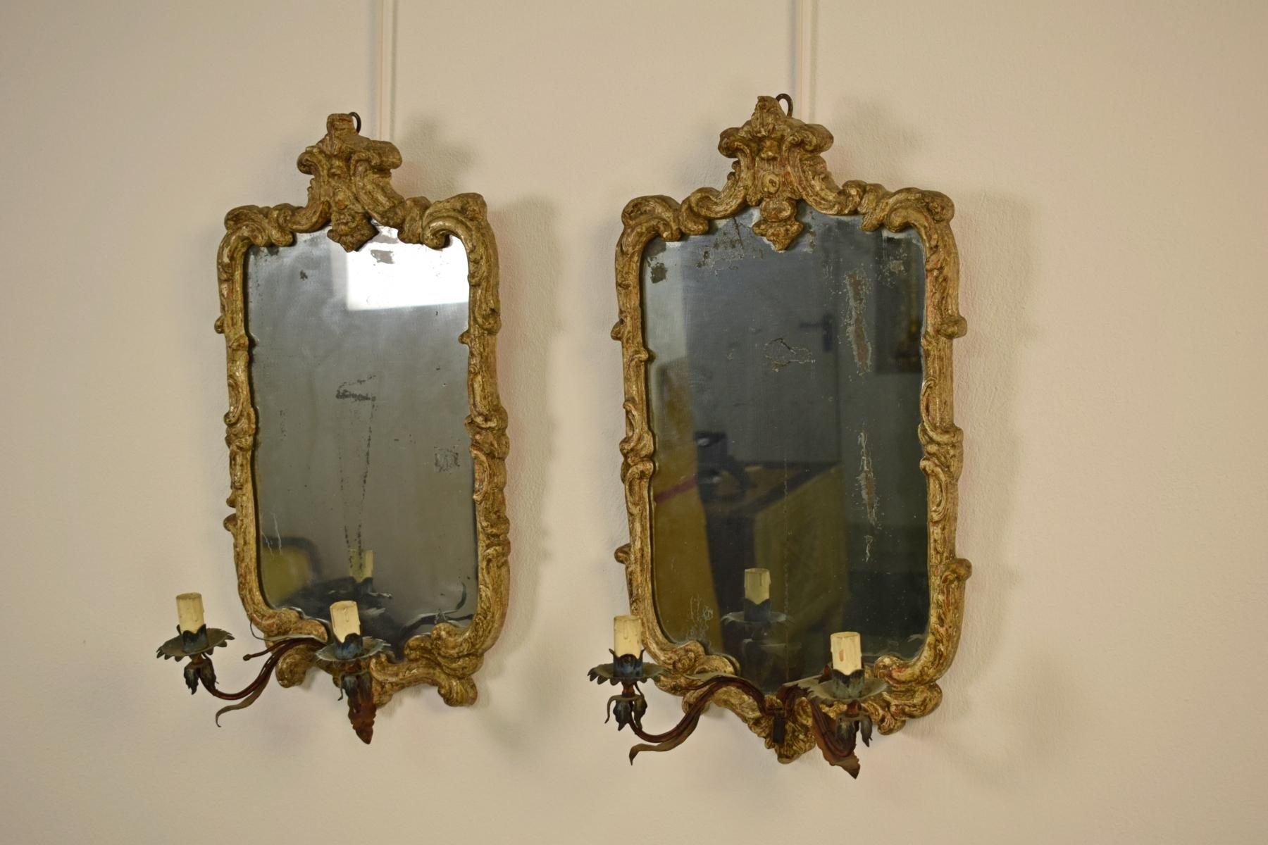 Pairs of Louis XV mirrors Piedmont carved wood, metal arms.

   