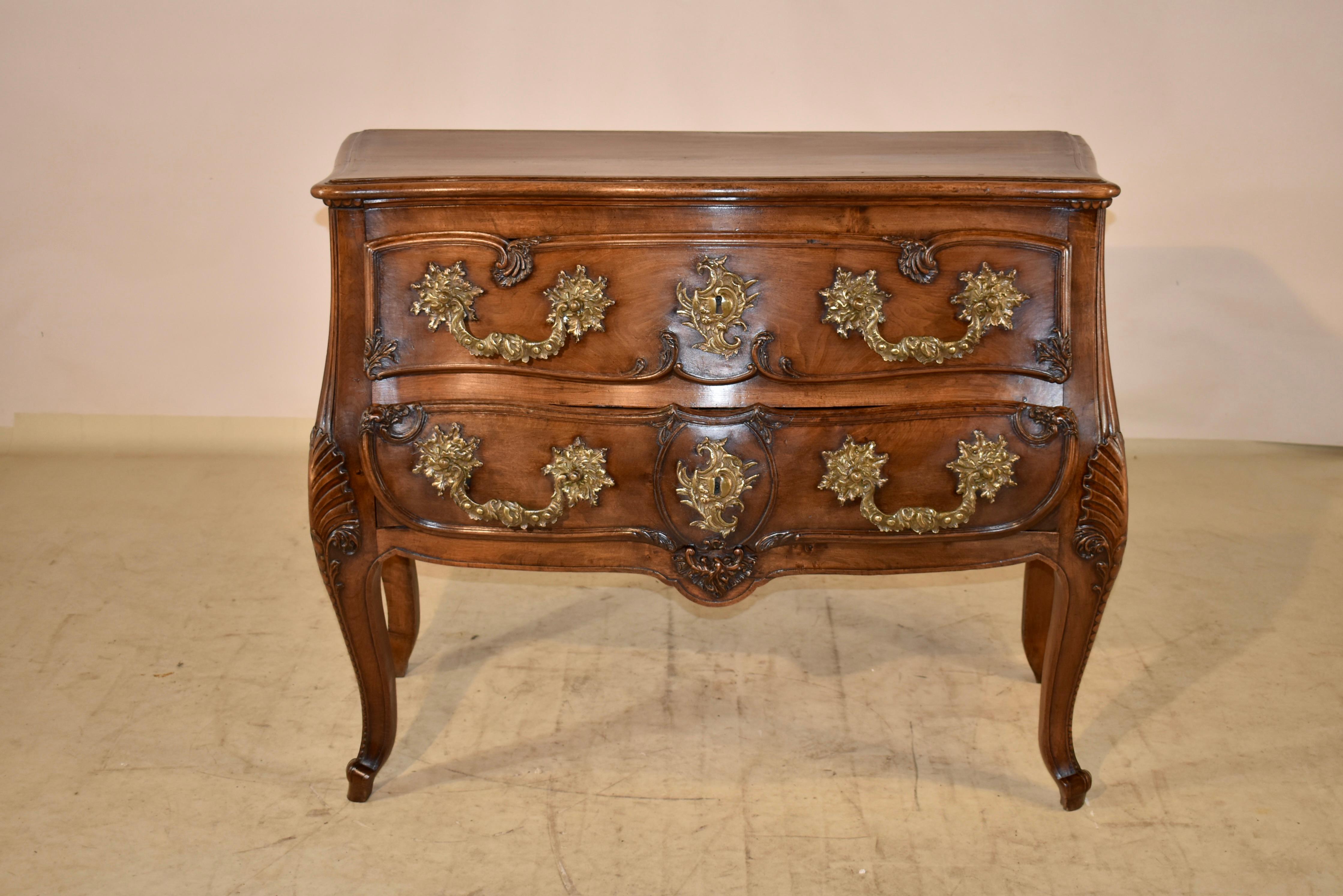 Superb quality 18th century period Louis XV two drawer commode. The top has scalloped and shaped edges, which are beveled and molded and follows down to hand paneled sides, which are also shaped. The commode has two drawers in the front, both with