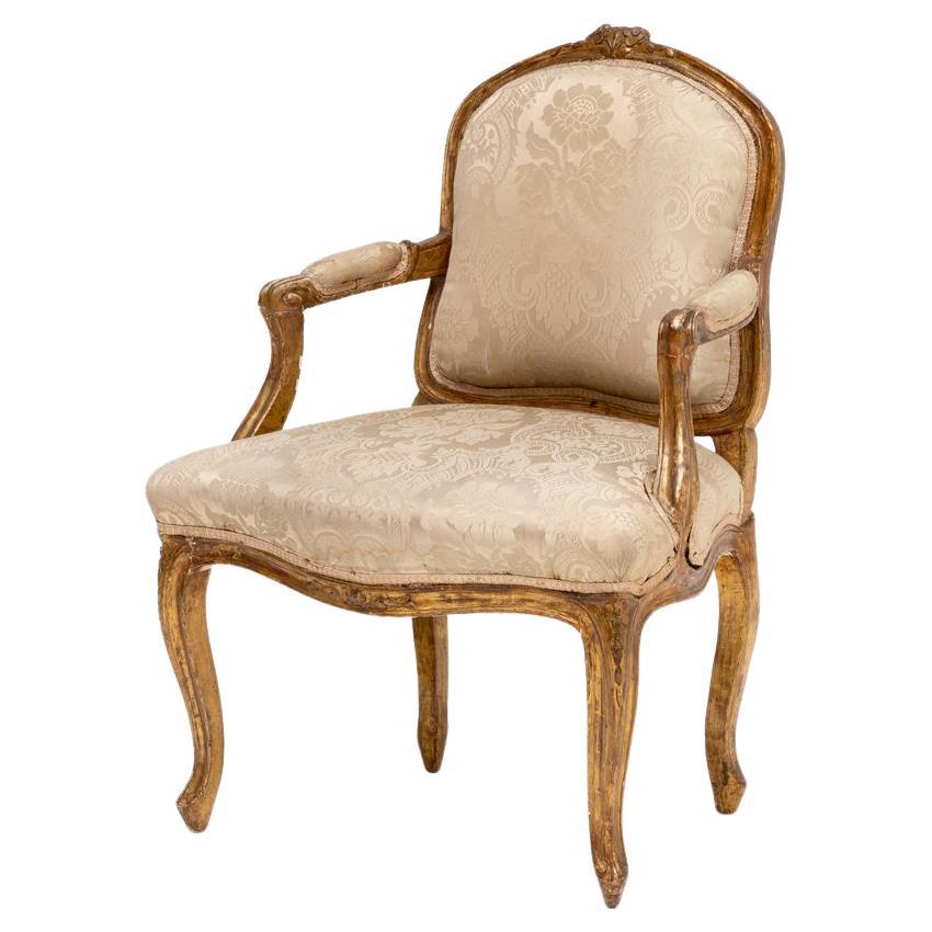 Sillón Luis XVI del siglo XVIII en madera tallada y dorada