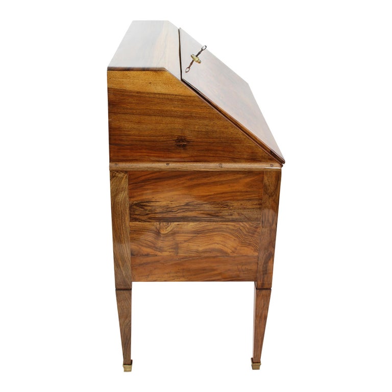 The Secretarie is made in France in the time of Louis XVI, the secretary is made of solid walnut and veneered on pine wood. The locks, fittings (brass), brass shoes of the feet are original from the time. The underside of the runners of the lower