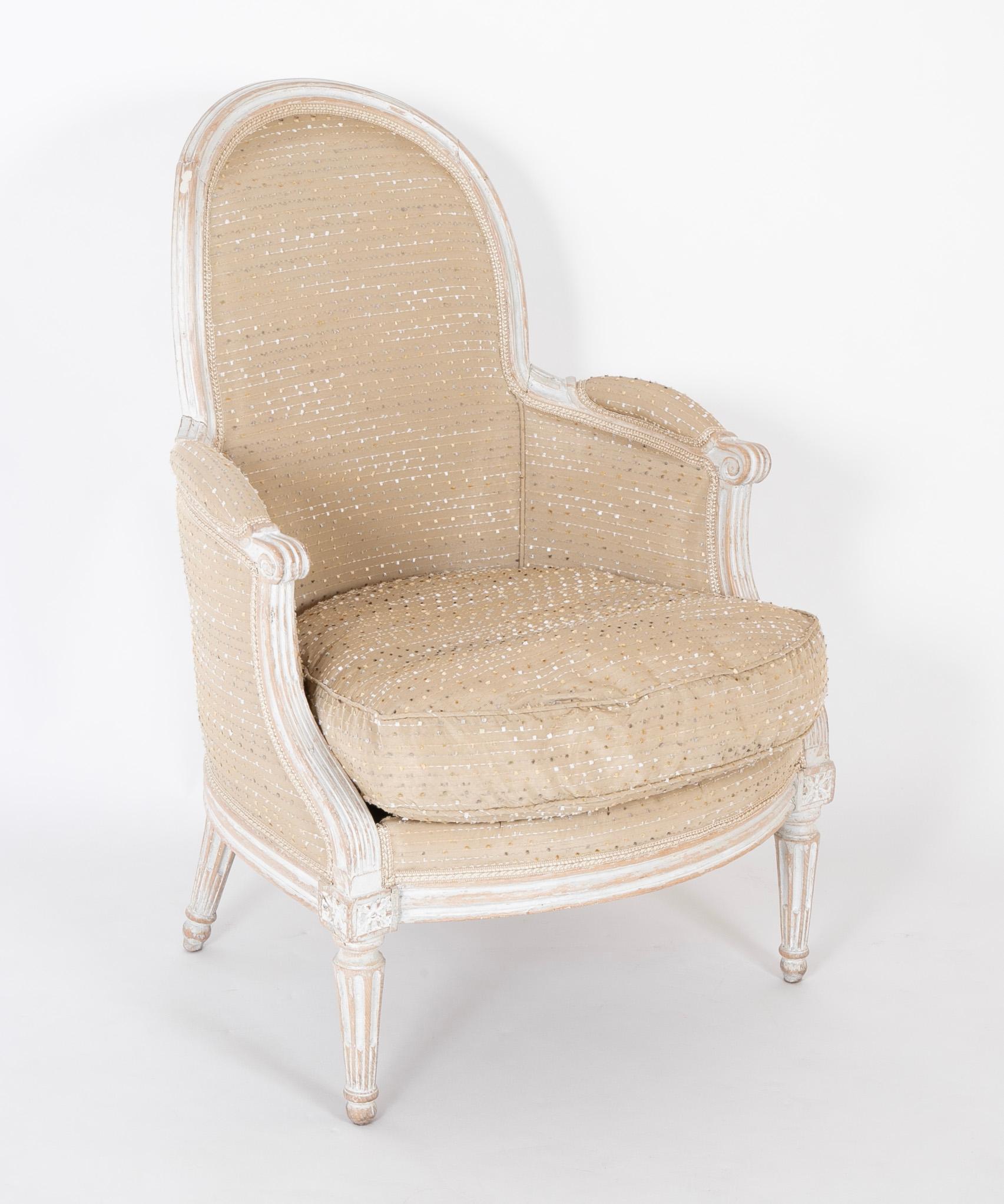 The frame of this chair has a wonderful scraped and waxed finish.  This is a period Louis XVI chair.    The oval back seat has a loose feather wrapped foam cushion newly reupholstered upholstered in a contemporary fabric, The chair rises hand carved