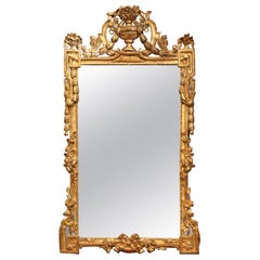 18th Century Louis XVI Carved Gilt Wood Mirror with Floral Vase and Swag Motifs