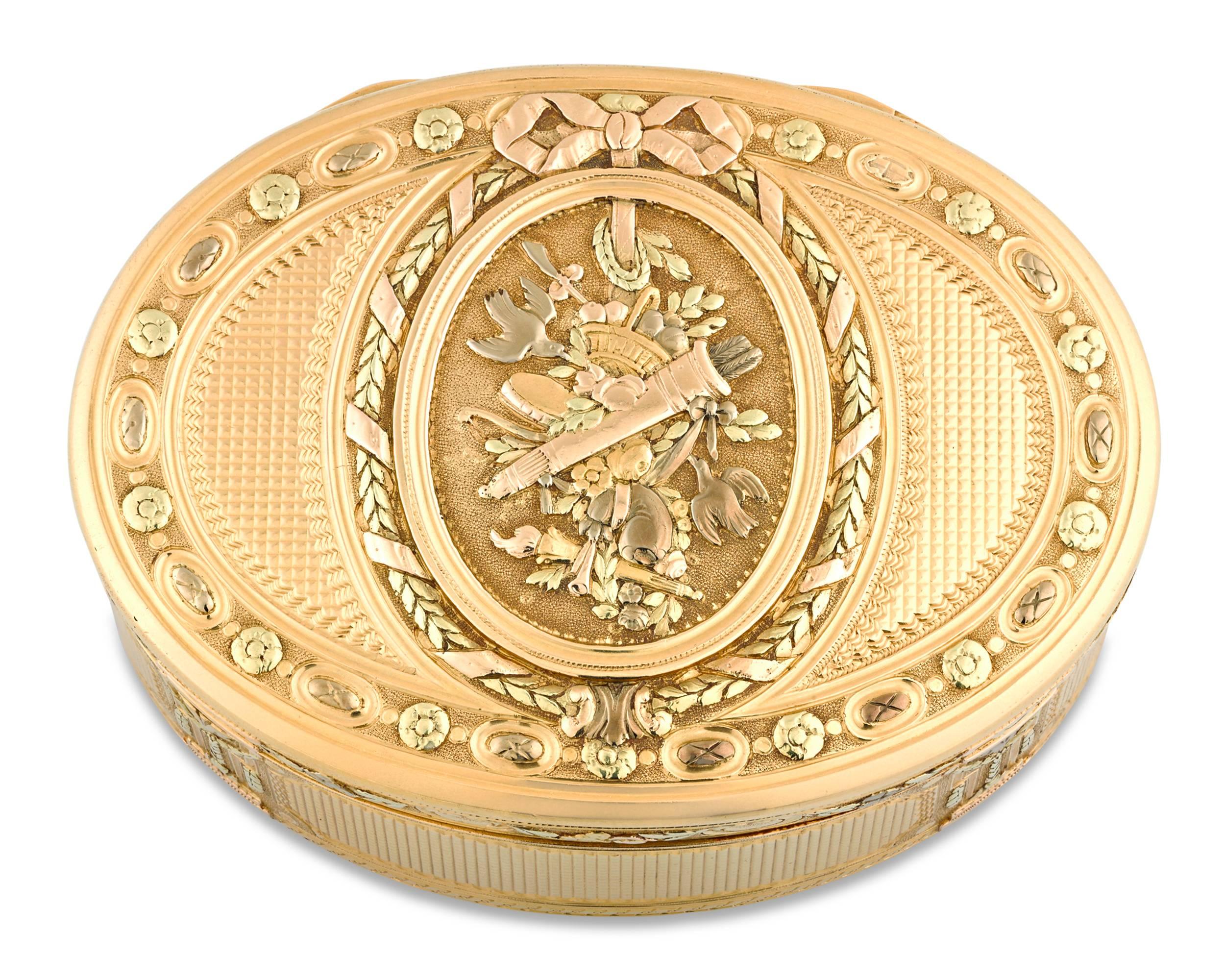 This remarkably rare Louis XVI oval tabatière, or snuff box, was crafted by the renowned Pierre Sevin of Paris. The vari-colored gold box embodies the elegant neoclassical style that prevailed during King Louis XVI's reign. All sides are etched and