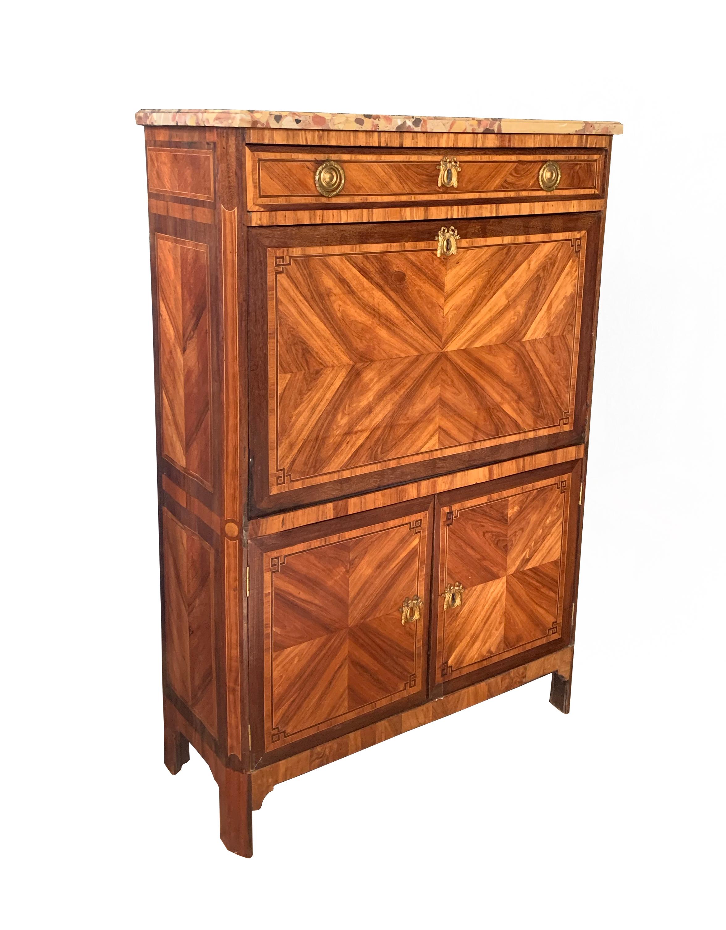 A stunning late 18th century Kingwood fall front desk. The case exhibits beautiful veneer and marquetry inlay. The case is topped by a slab of Breche d'Alep marble from the commune of Tholonet in Bouches-du-Rhône popularly used in fine 18th century