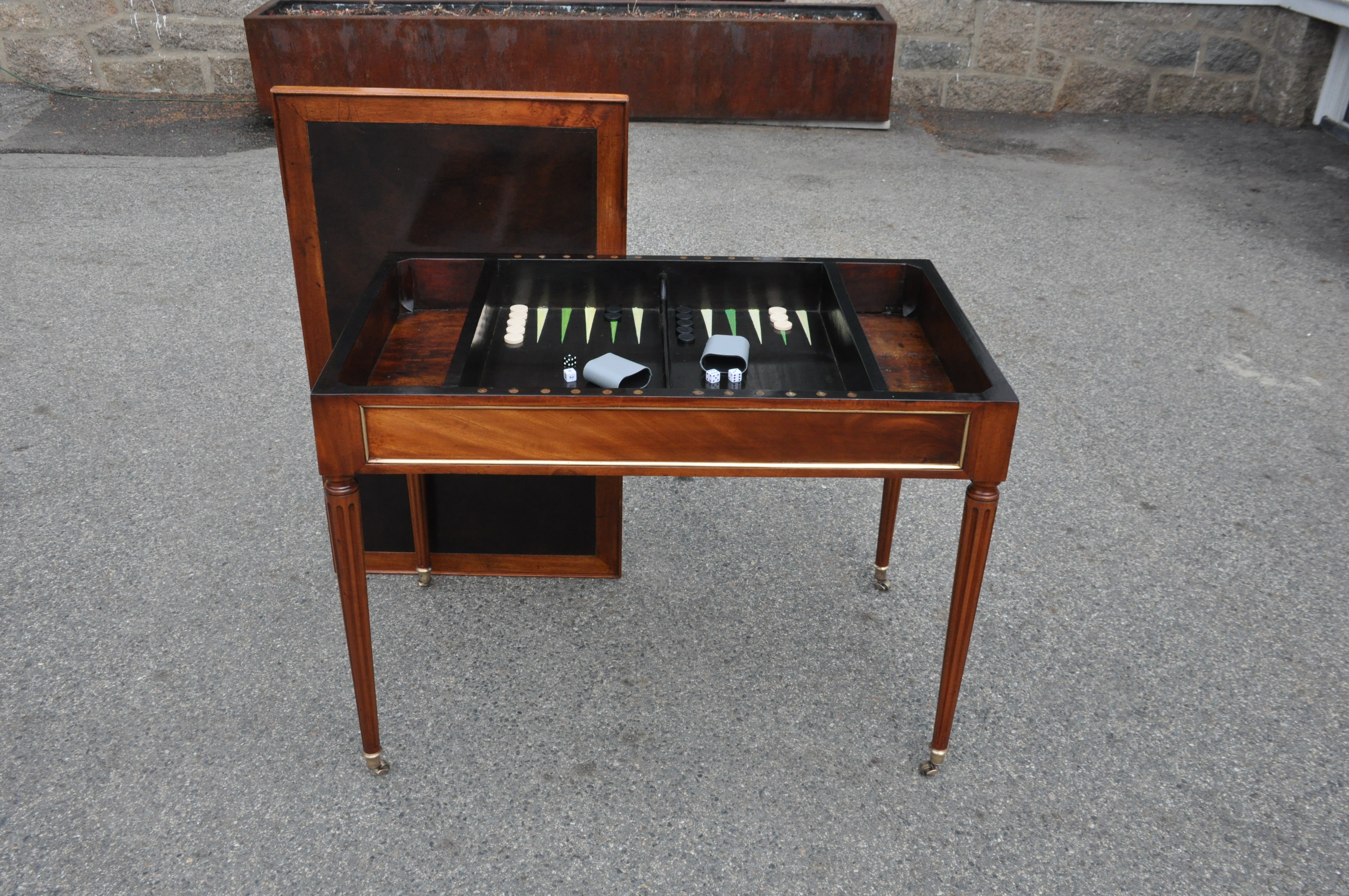 Period Late 18th Century Louis XVI Mahogany Brass Banded Tric-trac or Backgammon Table. Original Top that is Leather Fitted for Writing and Flips for a Felted Card Play. Provincial Well with Painted Backgammon Board Inside.