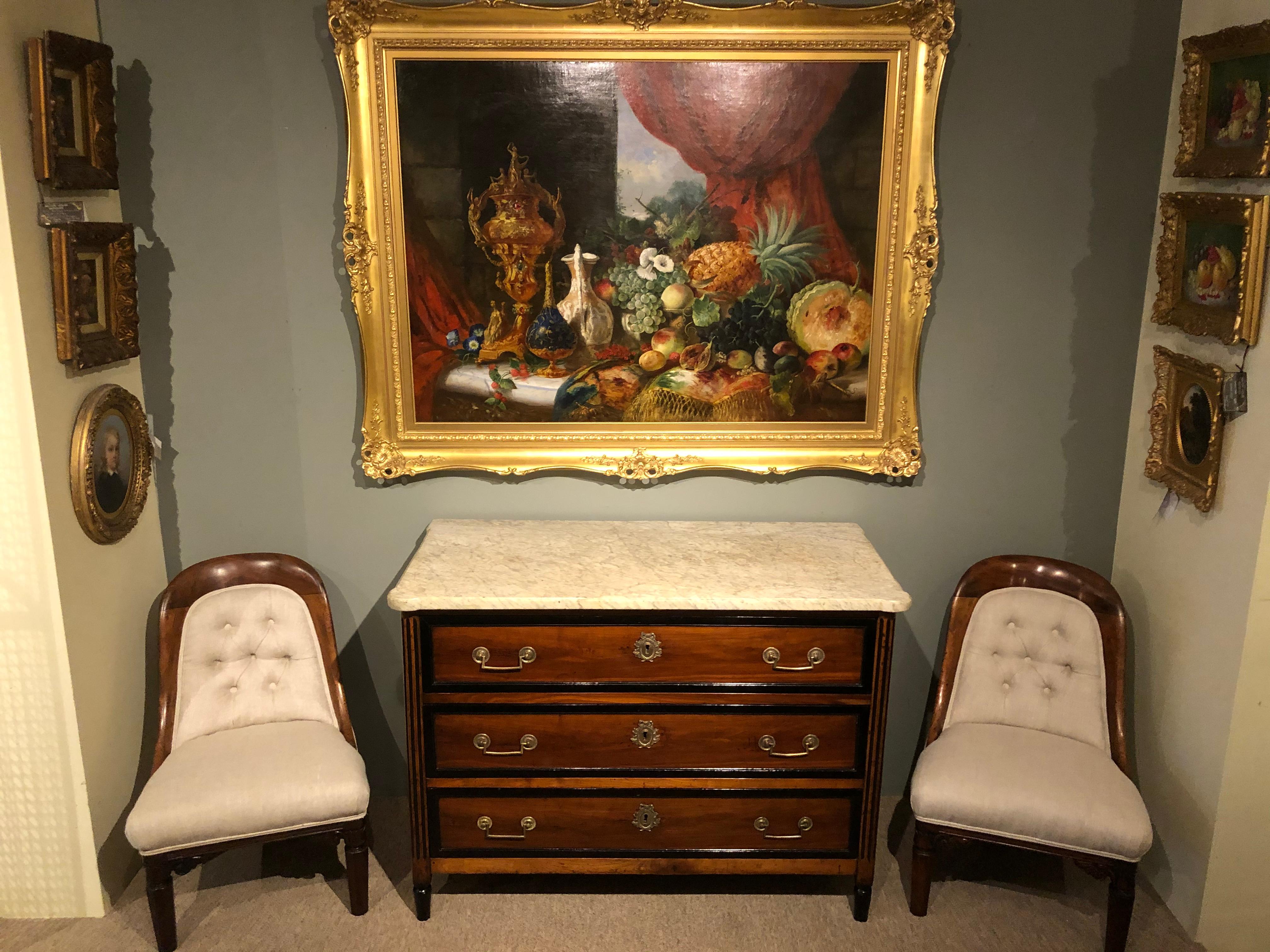 Handsome Louis XVI fruitwood and ebonized commode chest of drawers with original marble top and handles, with mirrored side panels and ebonized mouldings sympathetically restored by one of the UK's top furniture conservators.