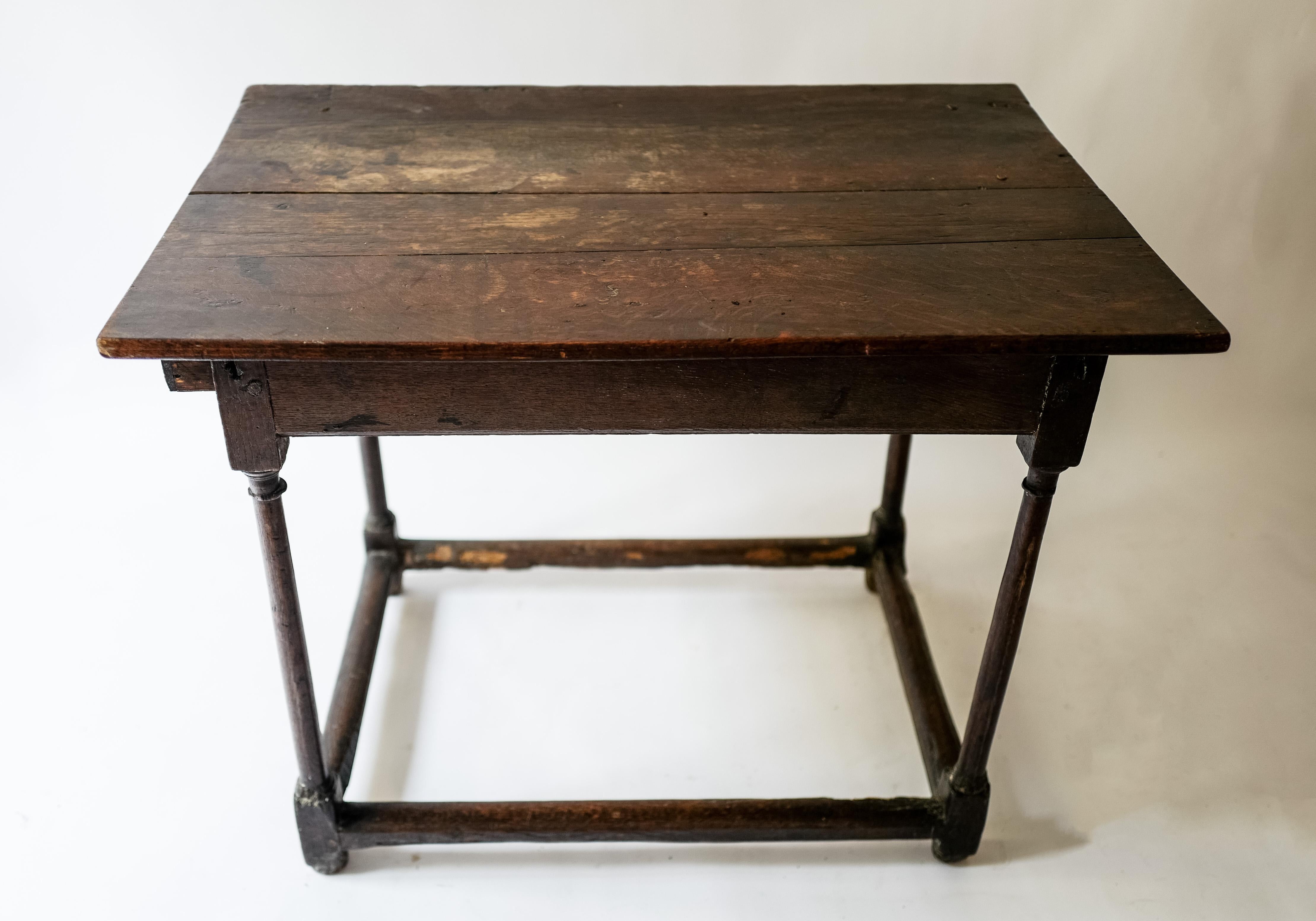 An 18th century Louis XVI oak side table with a single pull out drawer on one side. Beautiful time worn patin from Provence, France.