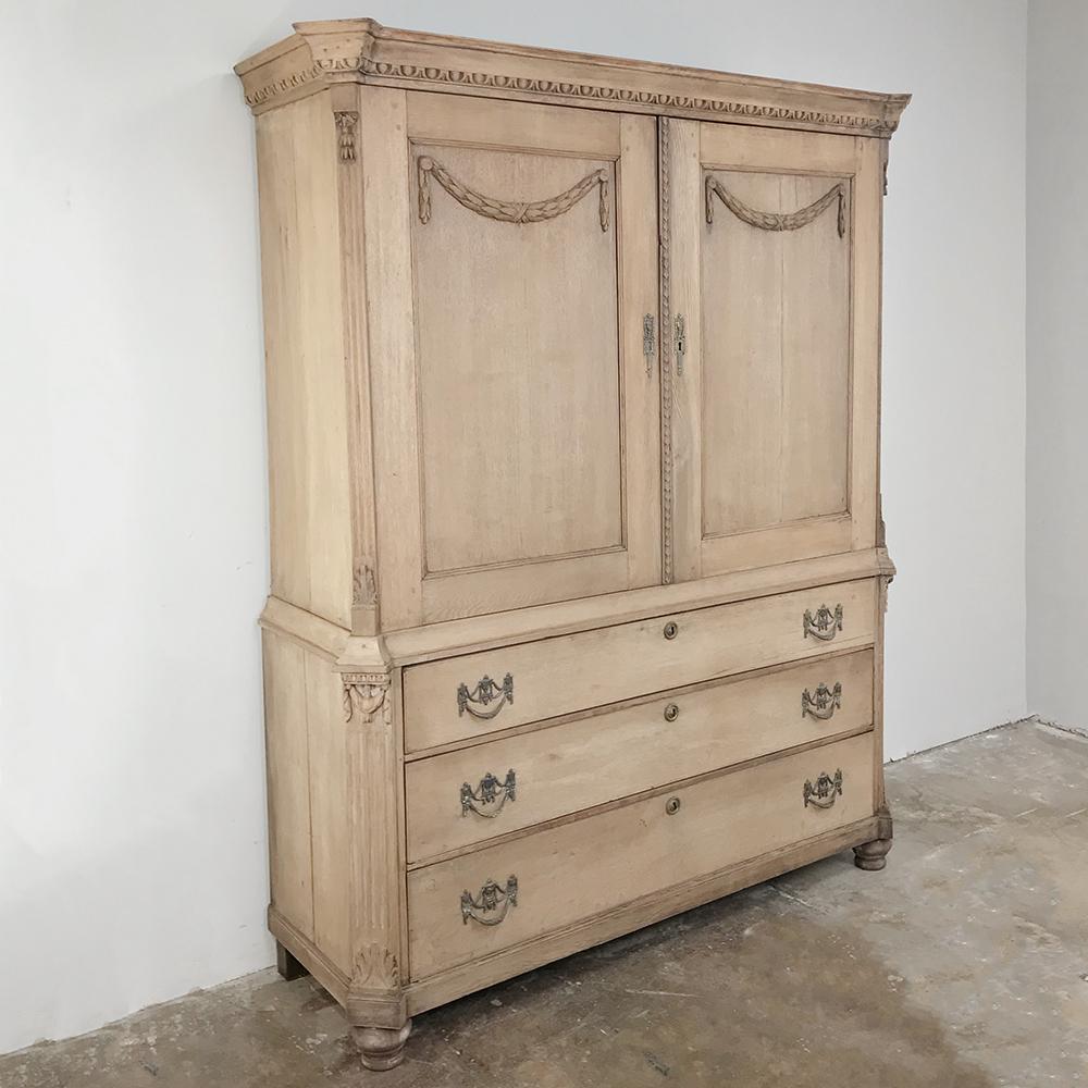 18th century Louis XVI period stripped oak Dutch wardrobe was handcrafted to create the perfect repository for all of one's clothes, something we in the 21st century take for granted with our walk-in closets! created from indigenous old-growth white