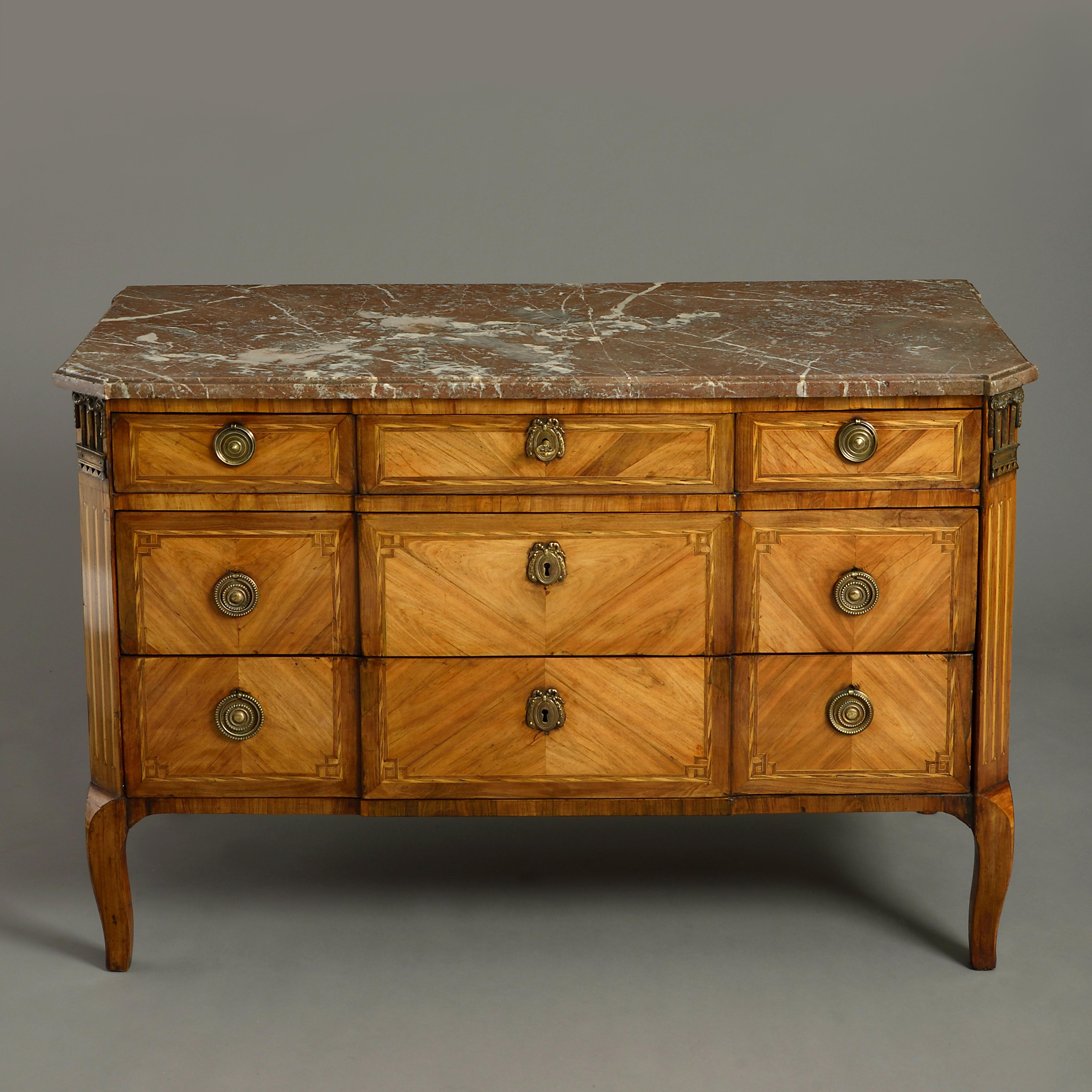 A mid-18th century Transitional Louis XVI Period parquetry commode, having a marble top above three short and two long drawers, veneered in tulipwood and sabicu and raised on cabriole legs.

    