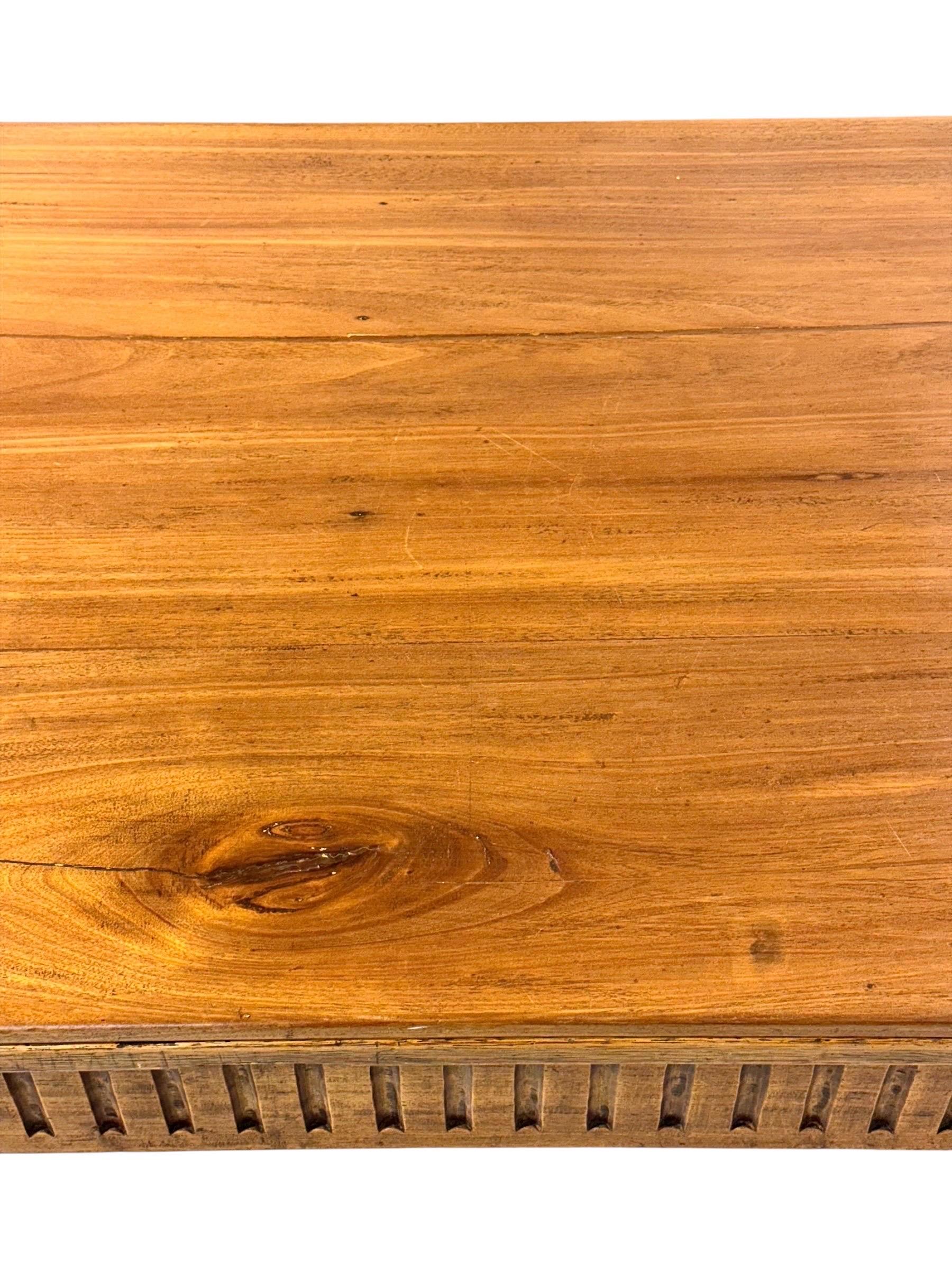 This authentic late 18th century Louis XVI table is a refined example of provincial French craftsmanship, constructed in a beautiful combination of solid walnut and warm fruitwood. Made during the reign of Louis XVI, the piece showcases the elegant