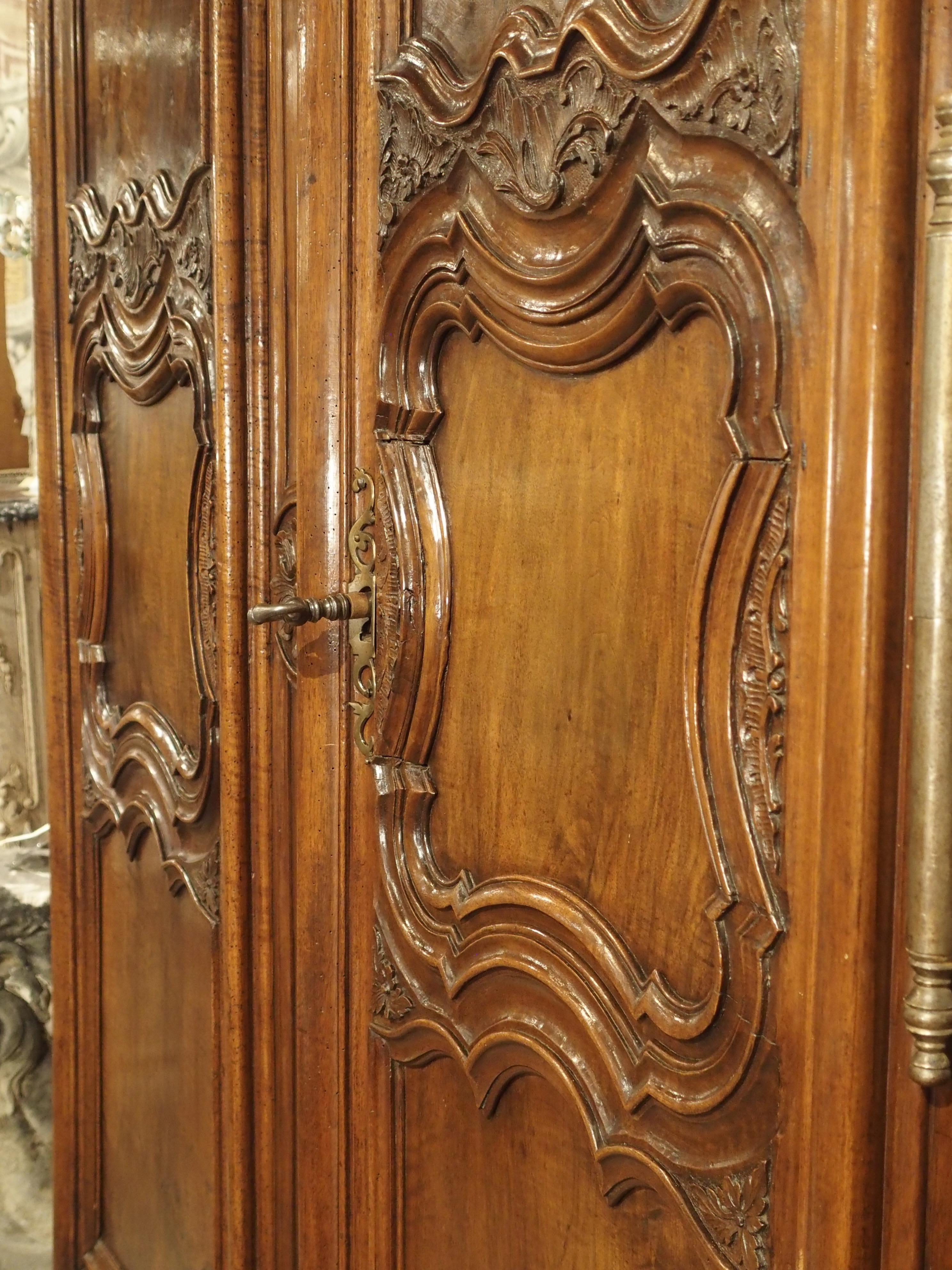 Louis XV 18th Century Lyonnaise Armoire in Carved Walnut Wood