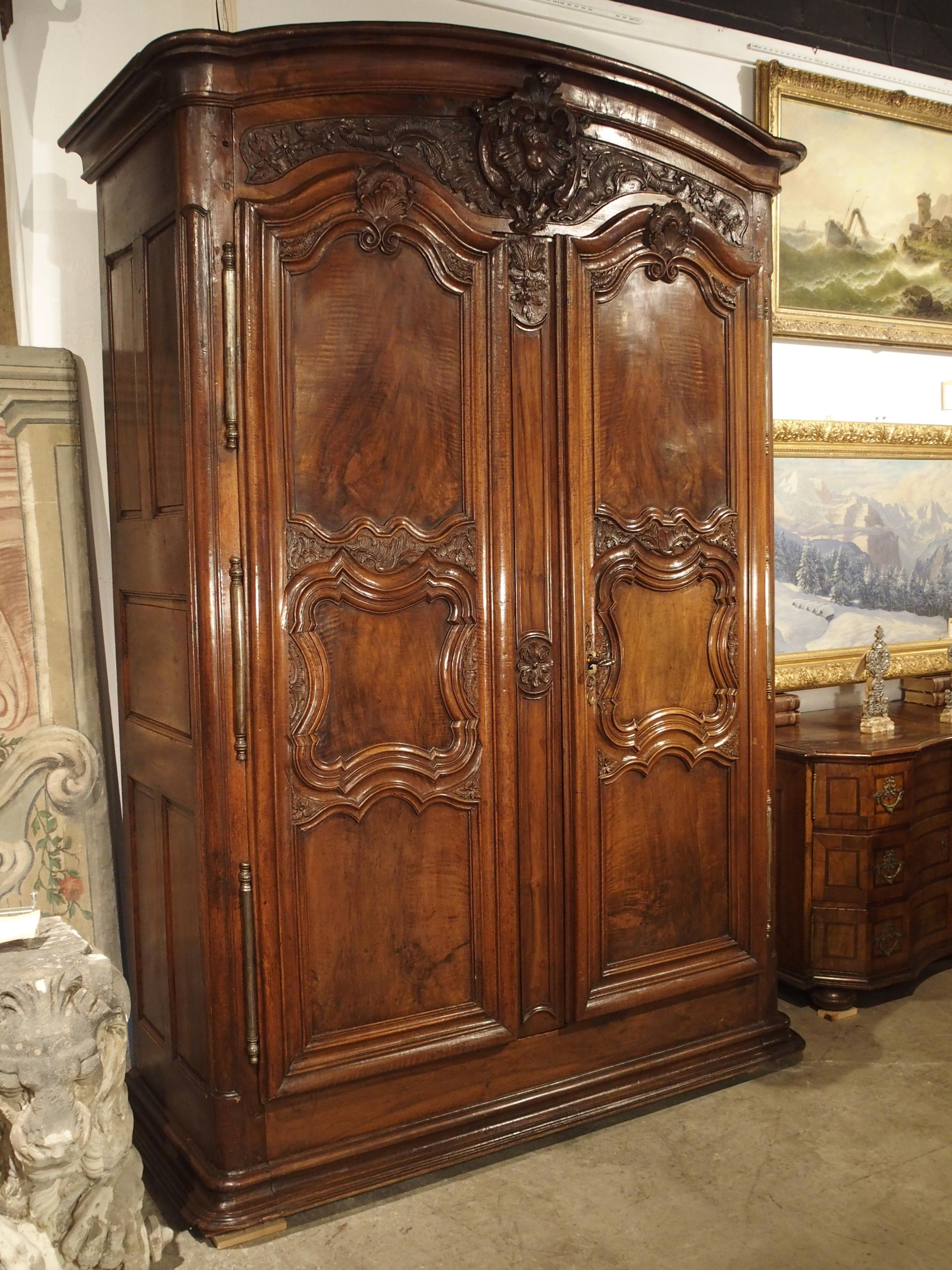 French 18th Century Lyonnaise Armoire in Carved Walnut Wood