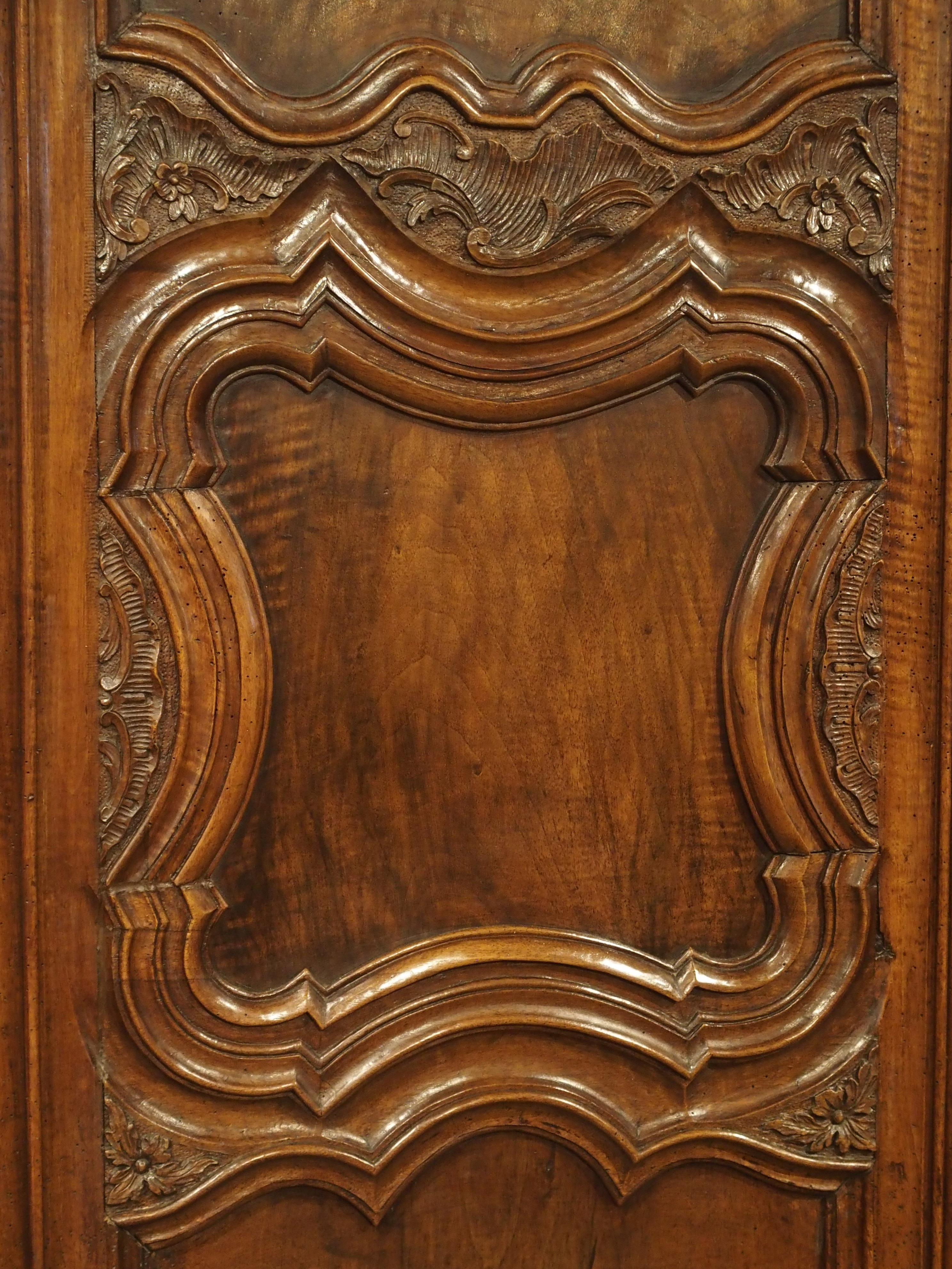 18th Century and Earlier 18th Century Lyonnaise Armoire in Carved Walnut Wood