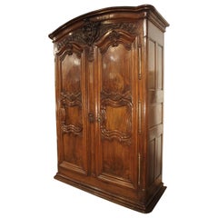 18th Century Lyonnaise Armoire in Carved Walnut Wood
