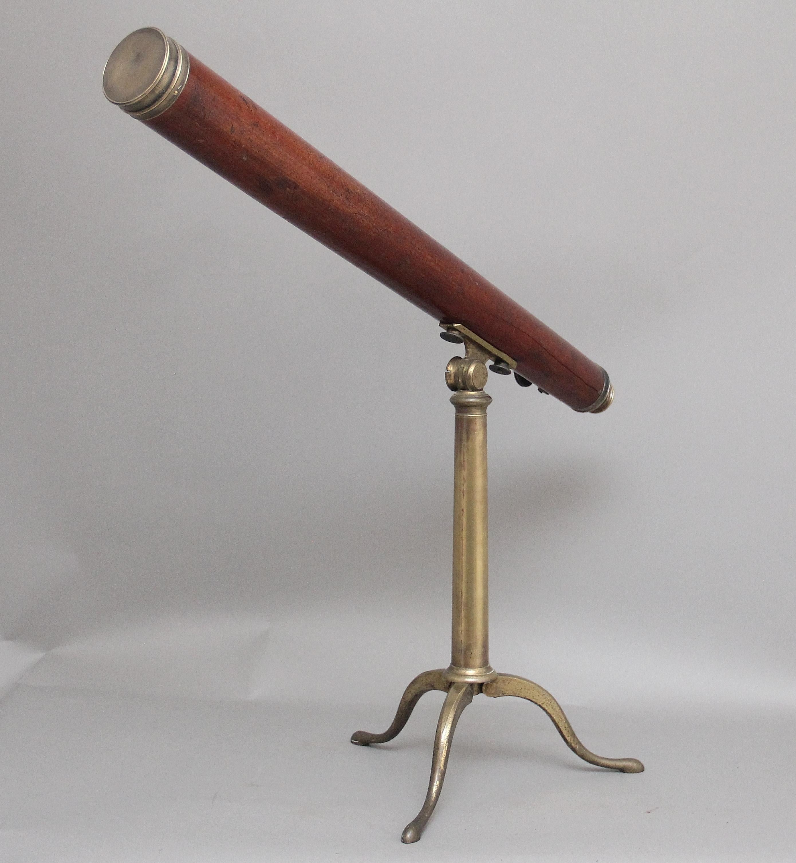 18th Century mahogany and brass telescope by Nairne & Blunt of London, having a mahogany barrel with a thumb wheel to the side of the main barrel, supported on a solid brass tripod stand with cabriole legs, the mount allows the mahogany barrel to