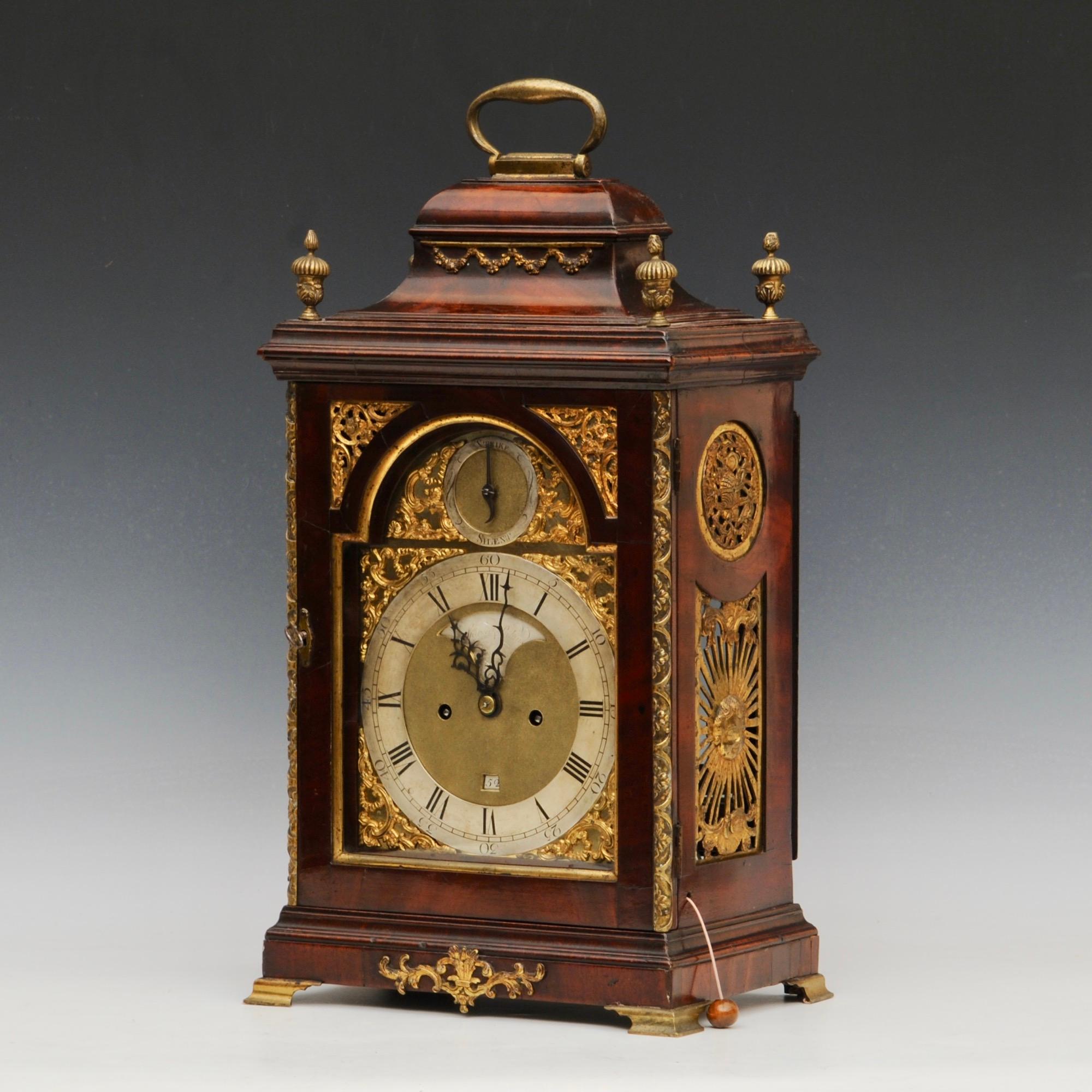 A fine example of a George III period mahogany eight day bracket clock with full brass dial by Spencer and Perkins, London.
The original verge movement with well engraved back plate and pull repeat. The flame mahogany case with good ormolu