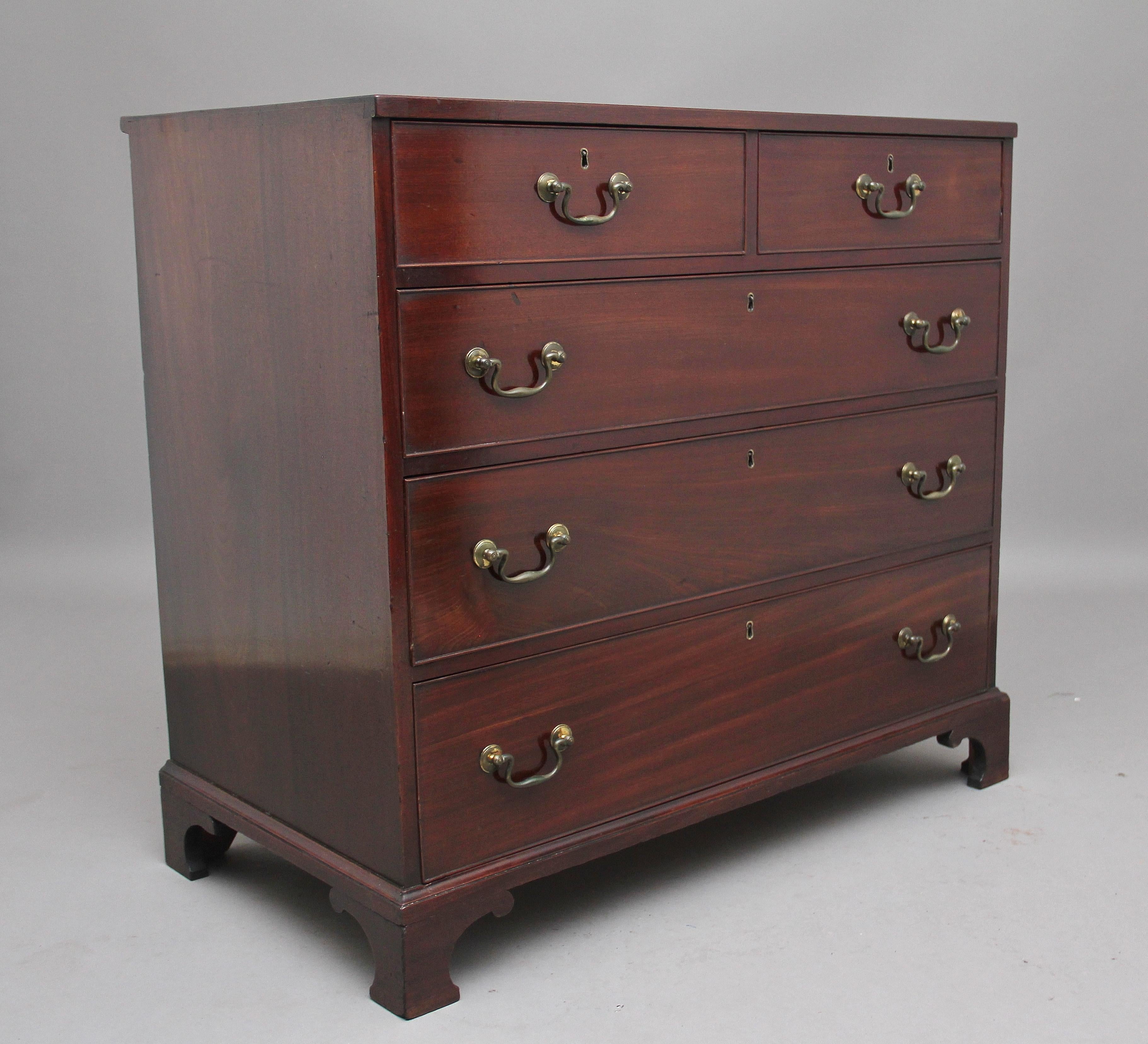 18th century mahogany chest of drawers, having a lovely figured top above a selection of two short over three long graduated drawers, oak lined with original brass swan neck handles, supported on shaped bracket feet, circa 1780.
 